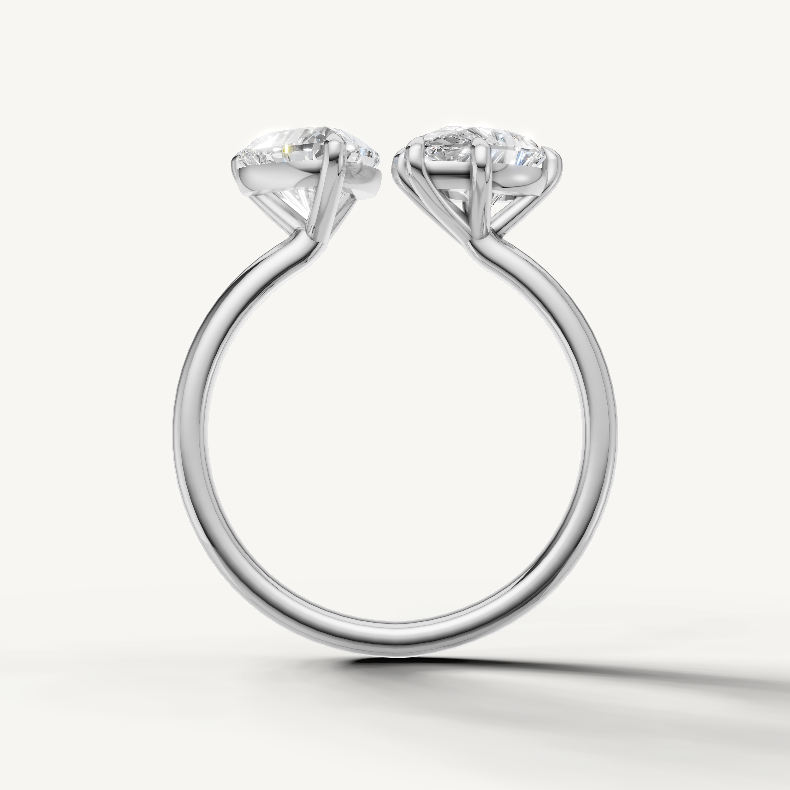 Elegant white gold pear and emerald solitaire ring crafted by Raul Diamonds