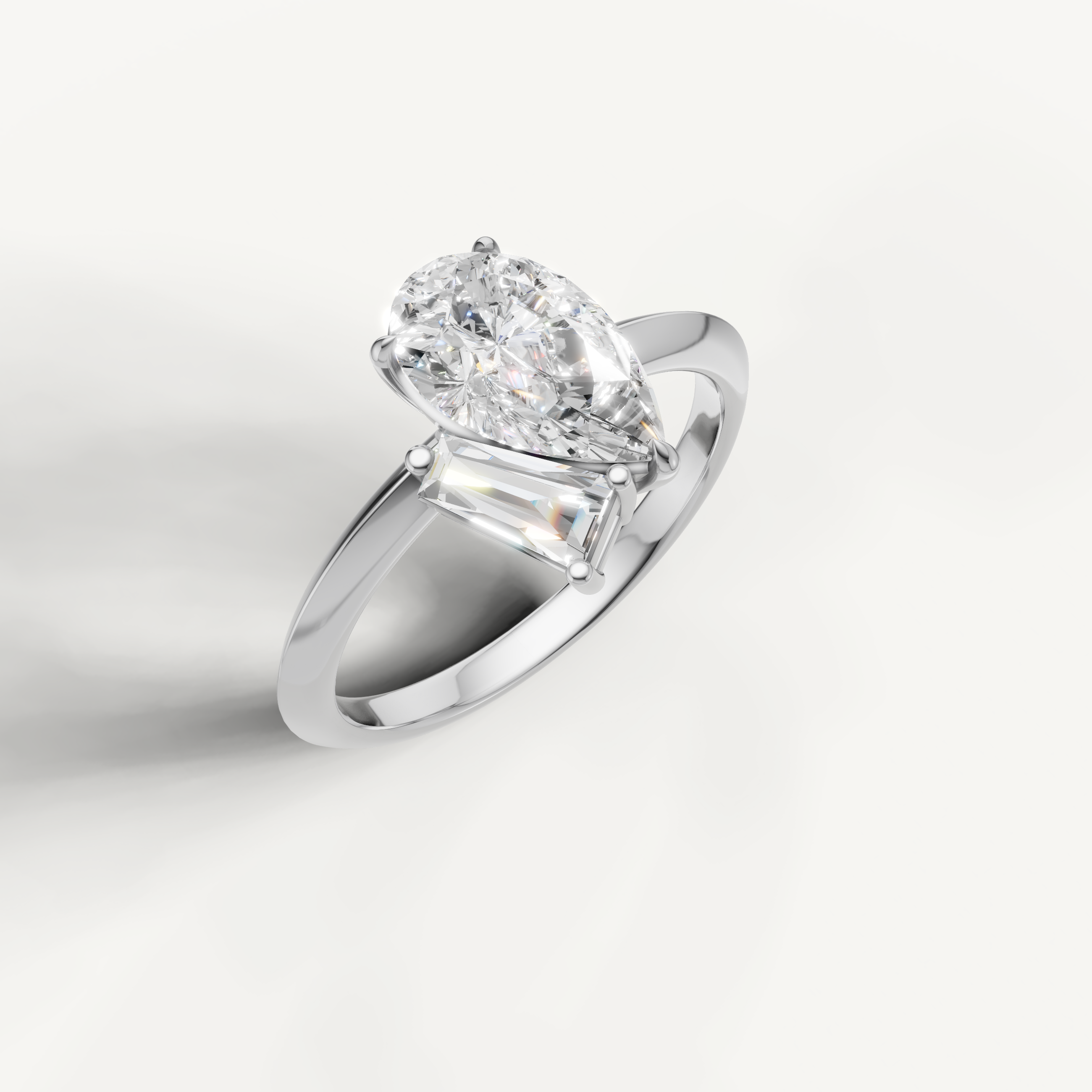 Elegant white gold pear and trapezoid diamond ring by Raul Diamonds