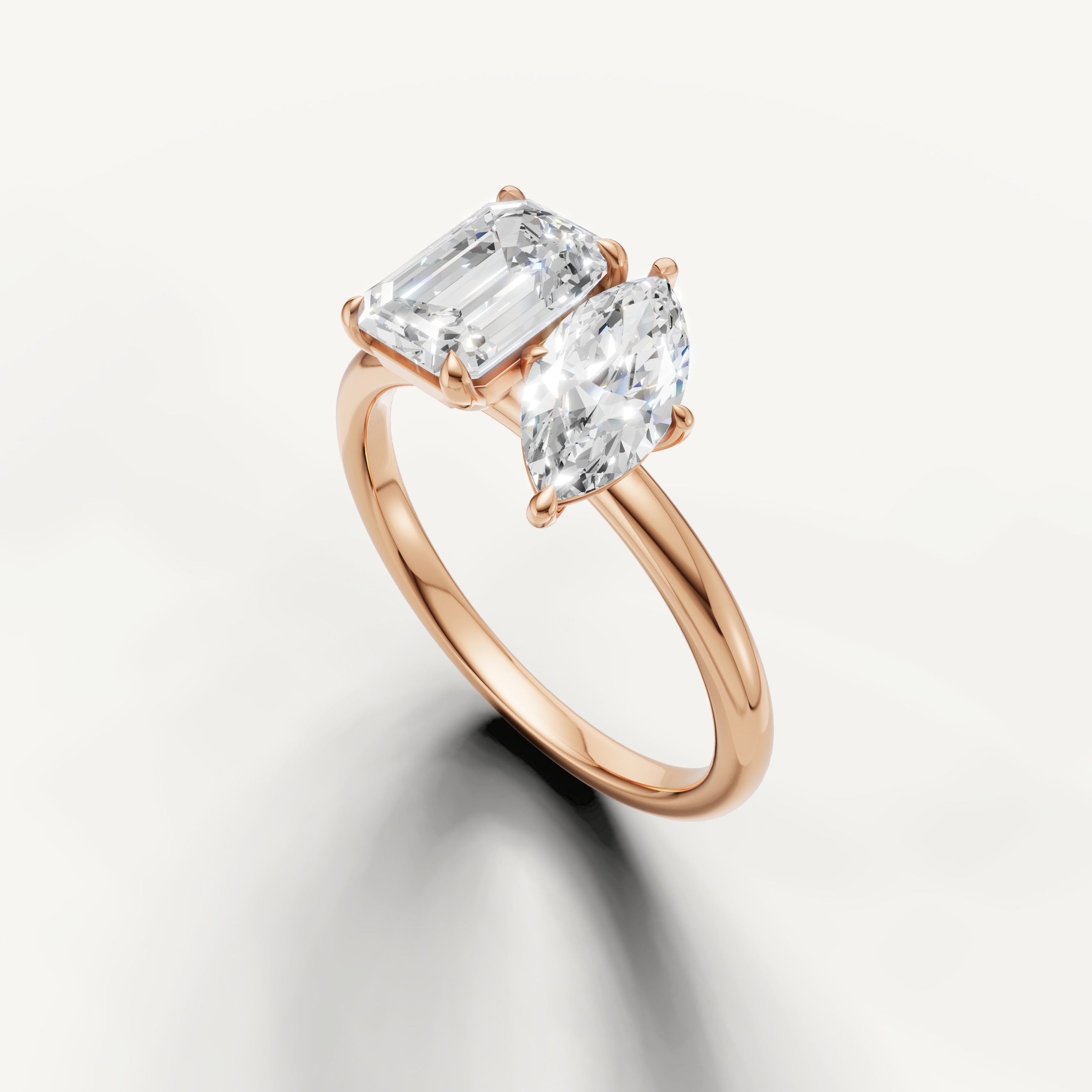 Romantic rose gold marquise and emerald cut engagement ring by Raul Diamonds