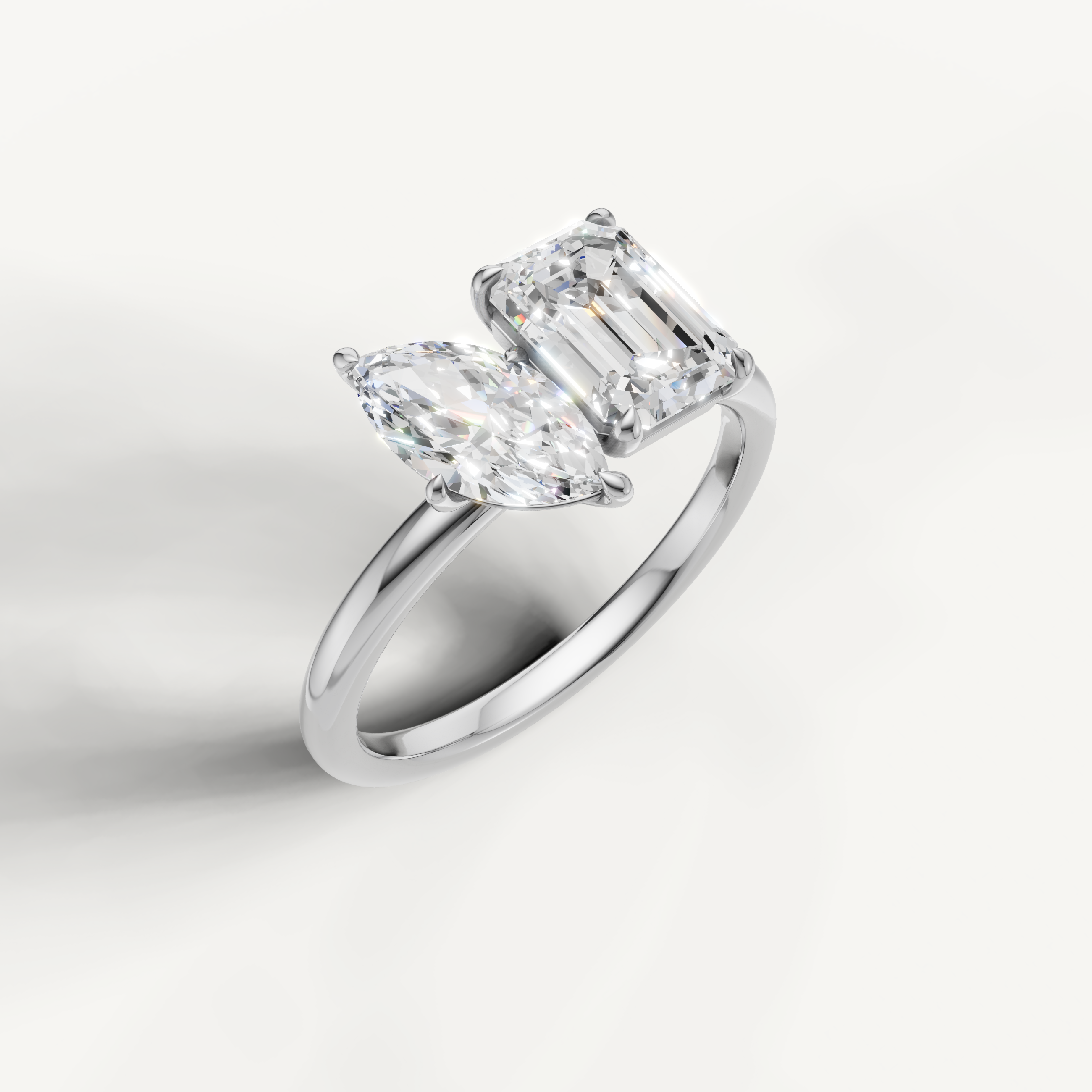 Elegant white gold marquise and emerald cut diamond ring by Raul Diamonds
