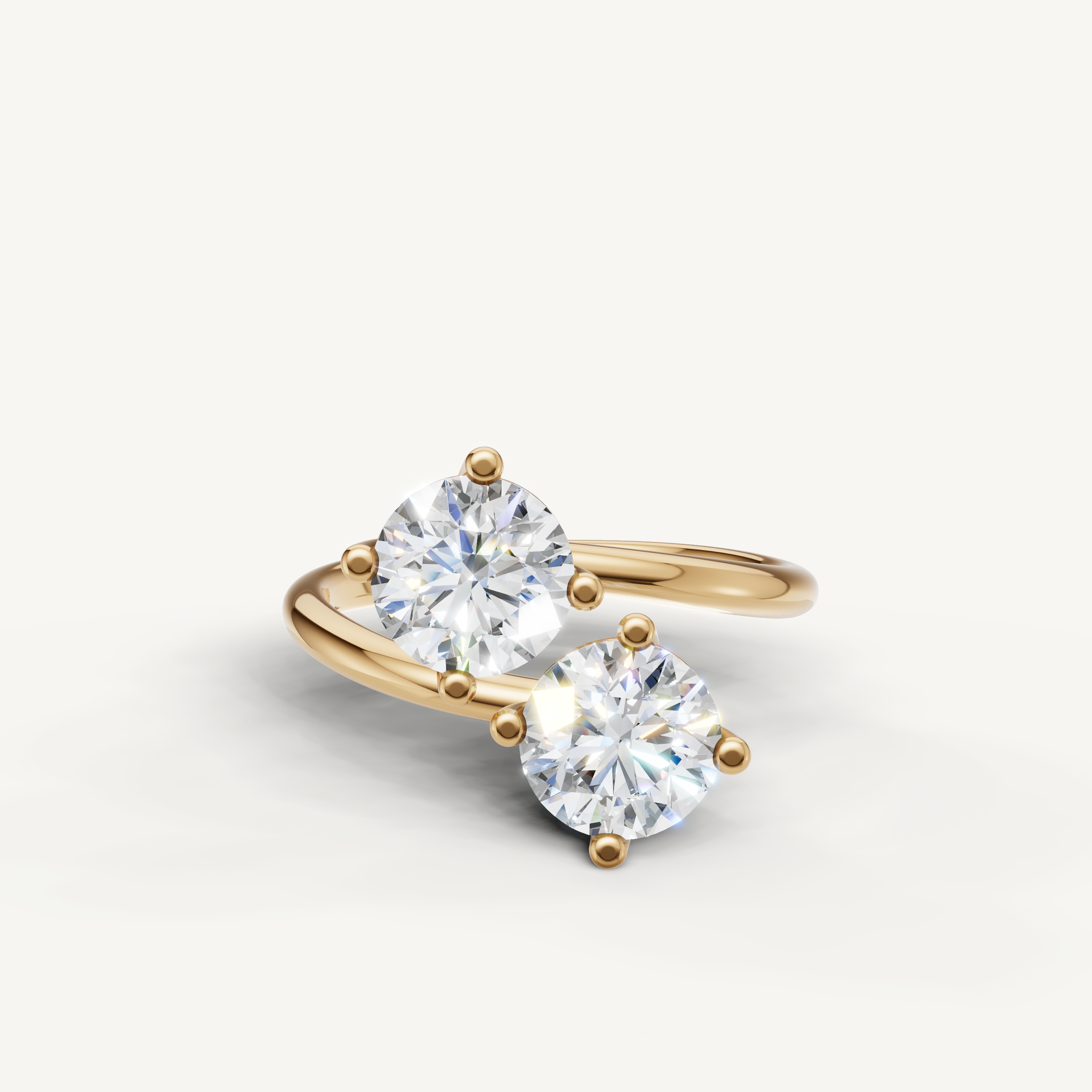 Raul Diamonds yellow gold bypass engagement ring with dual round cut lab grown diamonds