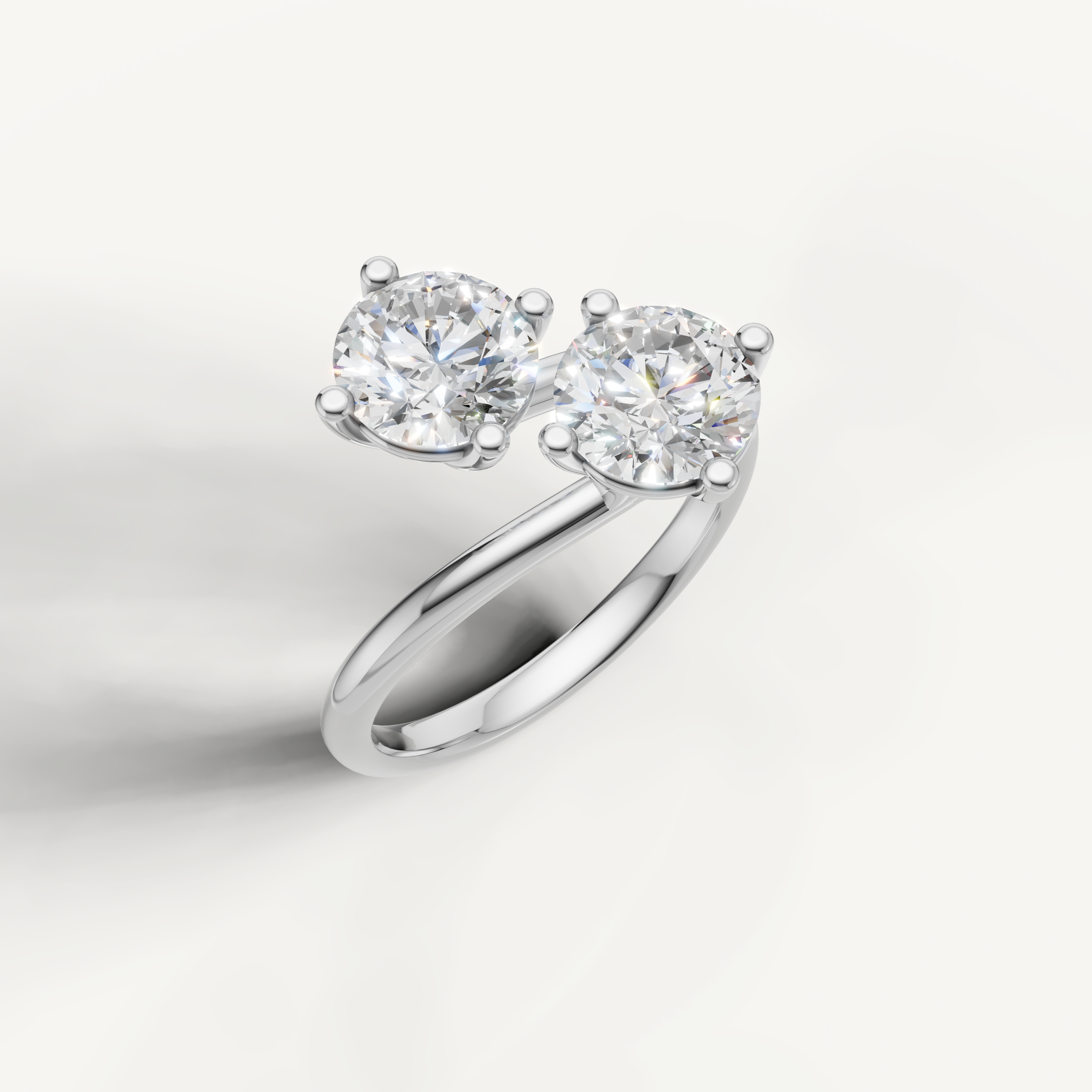 Elegant white gold double round diamond ring by Raul Diamonds with bypass design