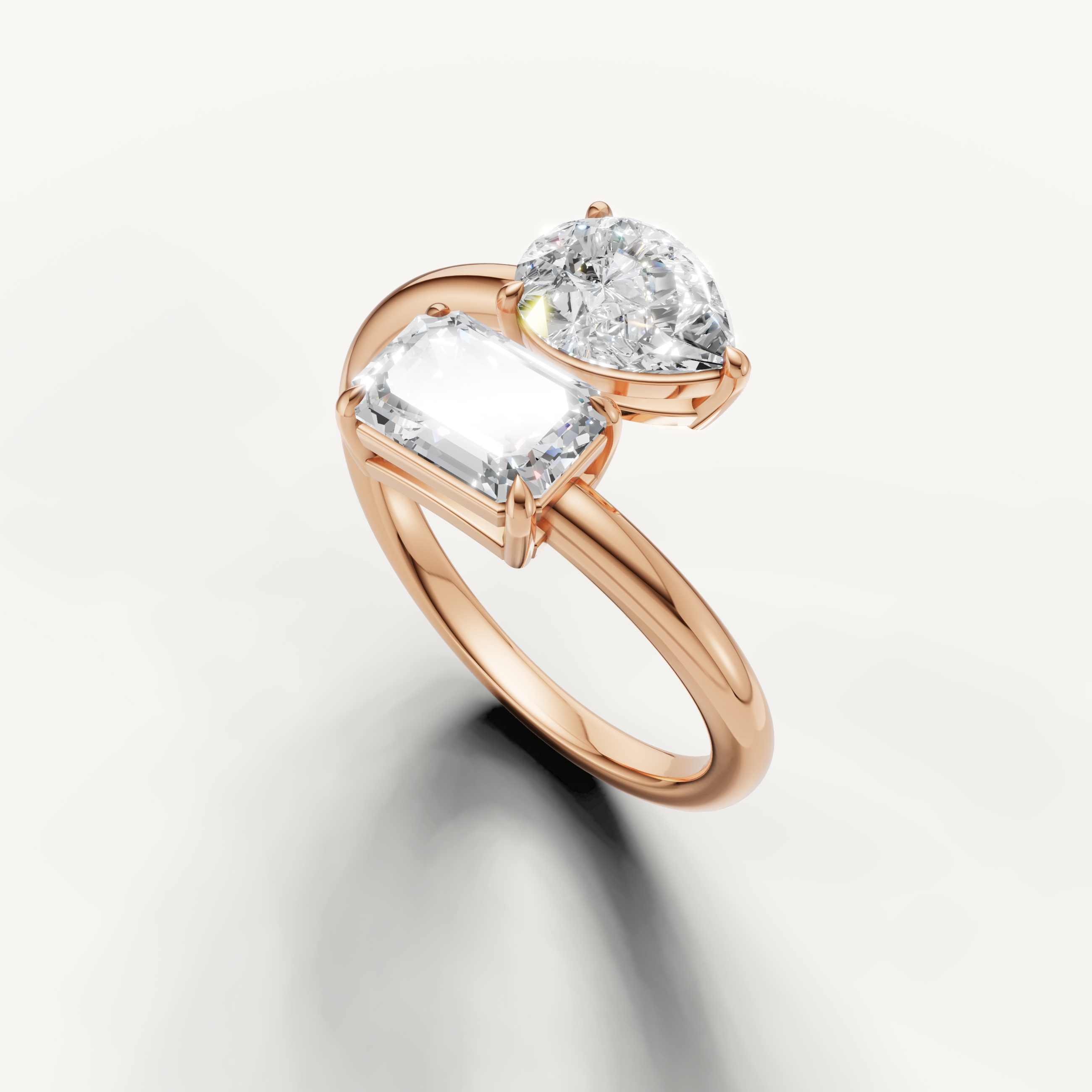 Luxury rose gold dual diamond engagement ring from Raul Diamonds with modern bypass style