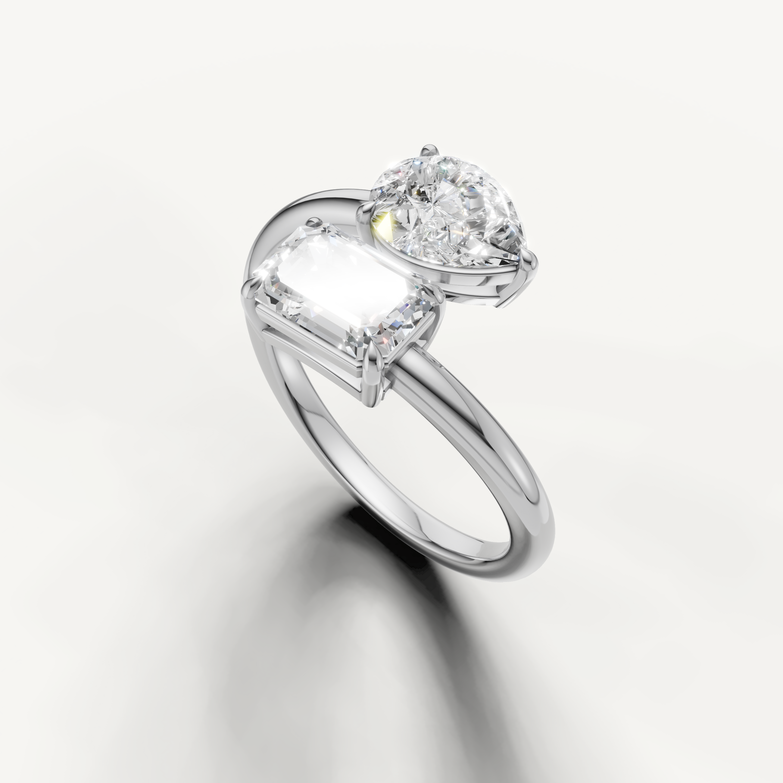 Modern white gold dual stone diamond ring by Raul Diamonds with sleek bypass design