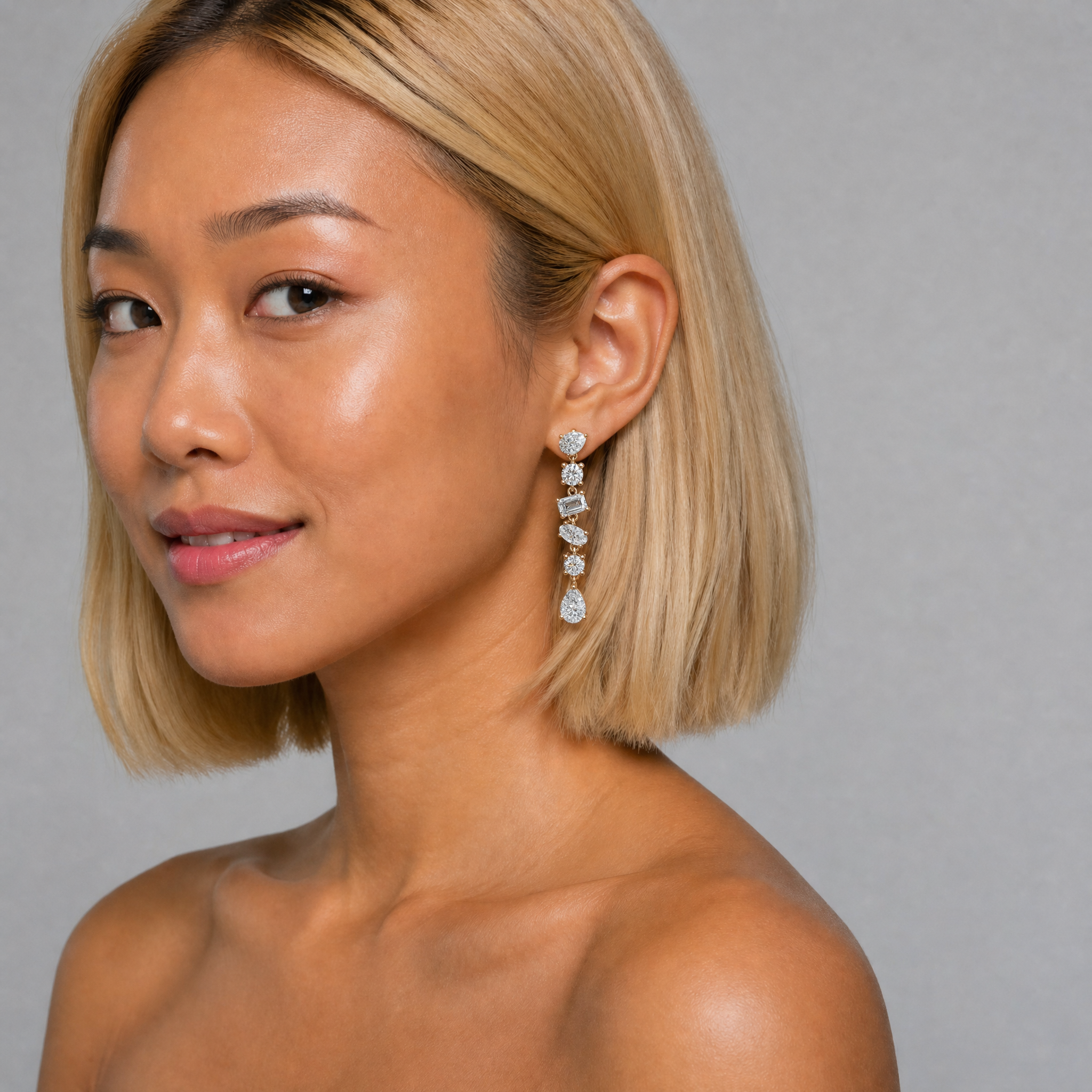 Elegant model wearing Raul Diamonds multi shape diamond drop earrings with luxurious brilliance