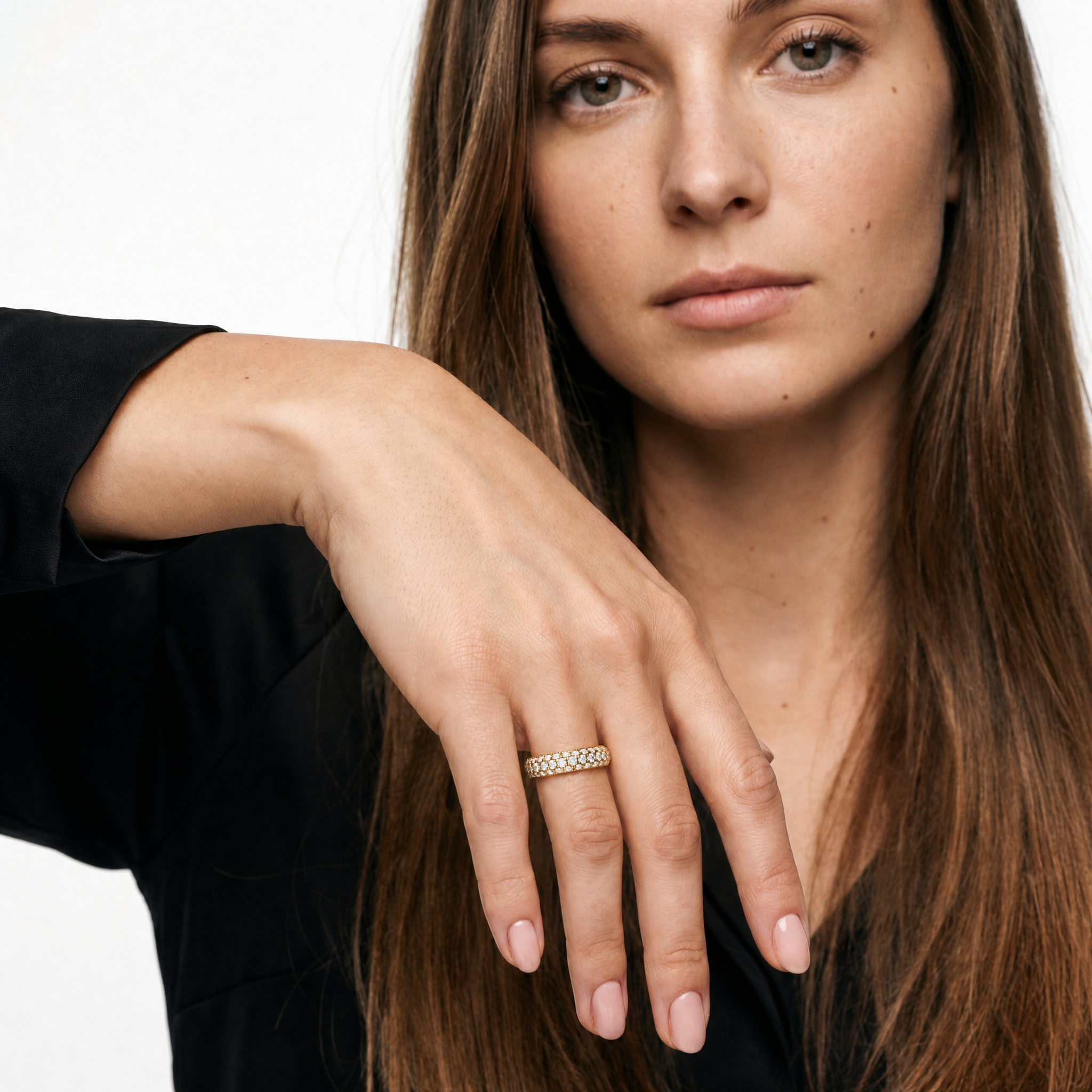 Elegant model wearing Raul Diamonds triple row diamond wedding band in luxury bridal jewelry styling