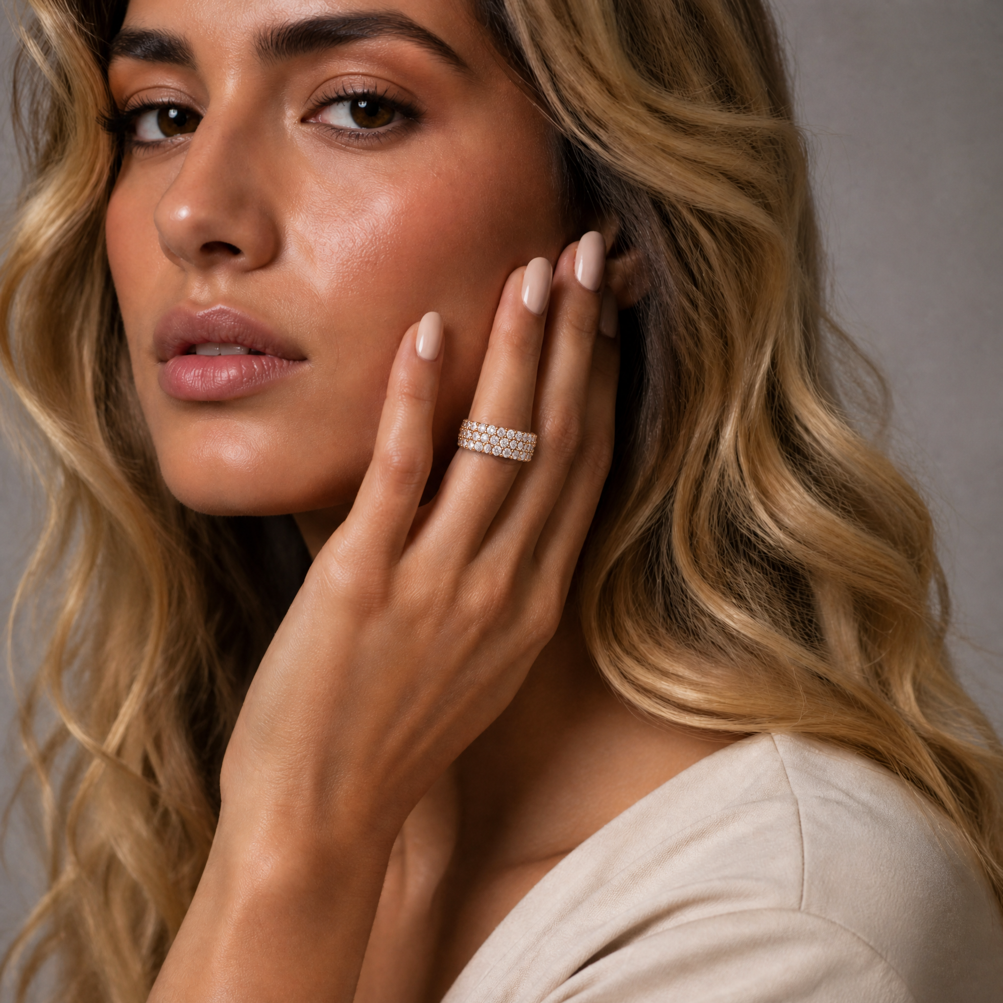 Female model wearing Raul Diamonds yellow gold multi row diamond wedding band with pavé diamonds in luxury beauty portrait