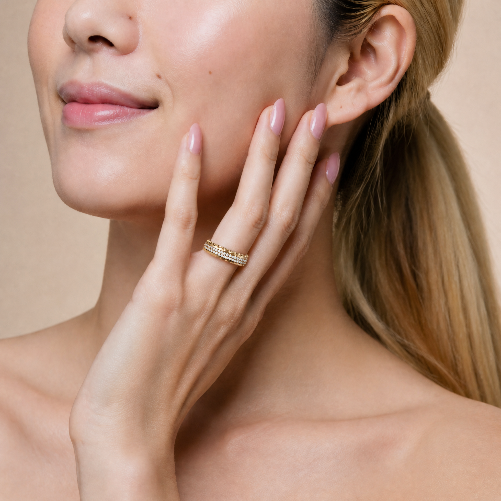 Sophia Elise wearing a Raul Diamonds yellow gold diamond wedding band with triple pavé rows and textured luxury detailing