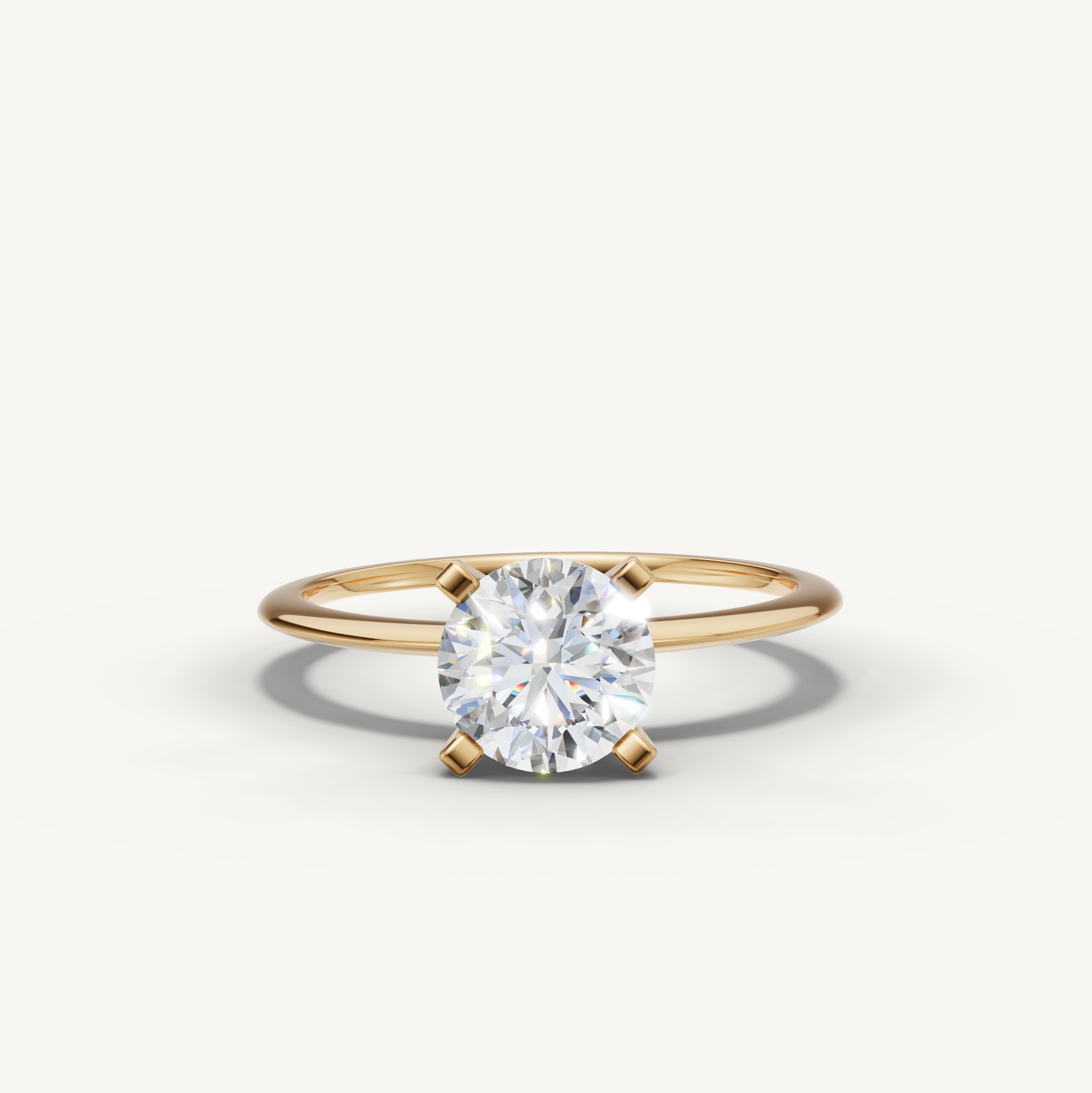 Round cut lab grown diamond solitaire engagement ring in yellow gold by Raul Diamonds