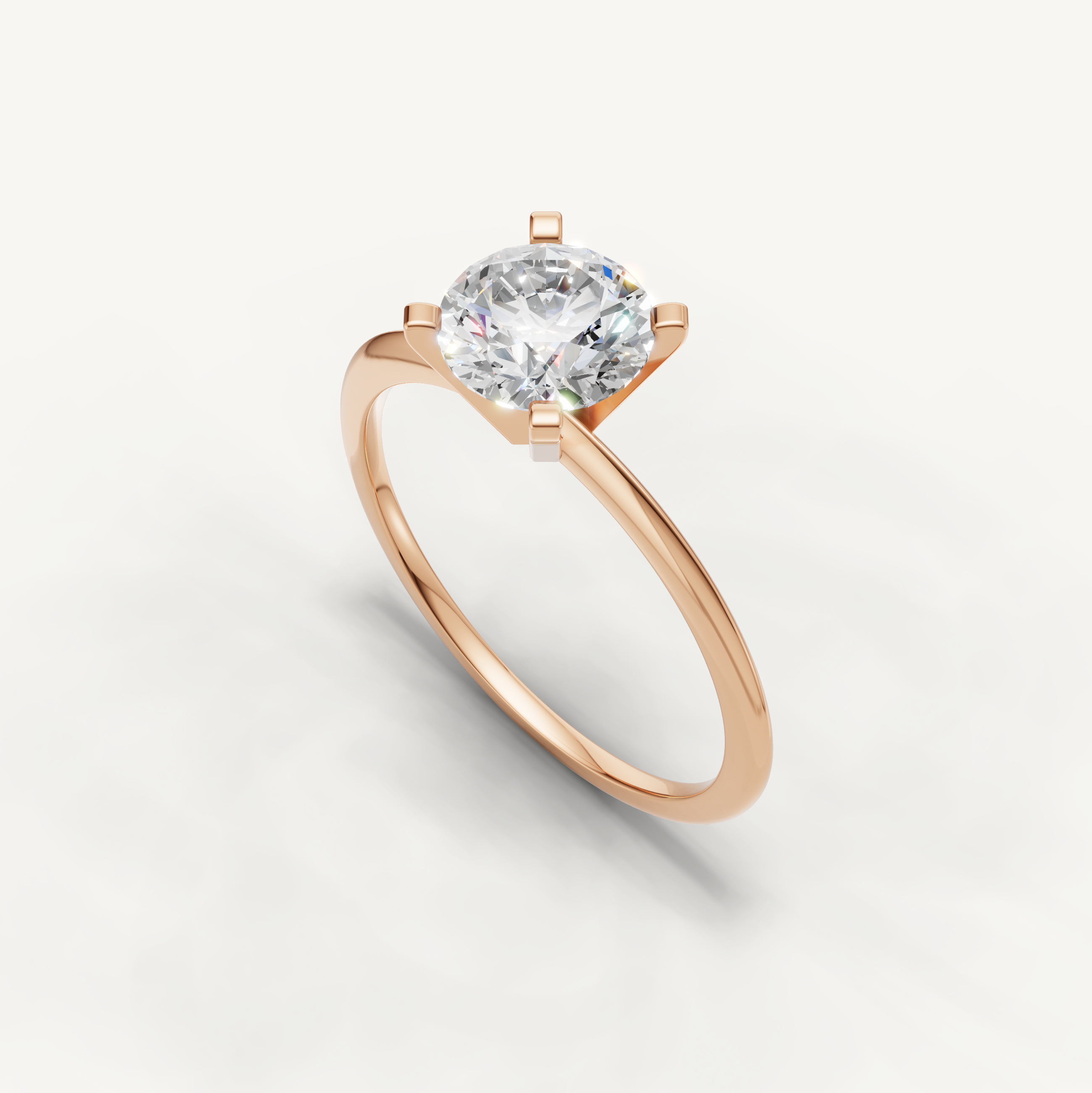 Thin band round solitaire ring in rose gold by Raul Diamonds