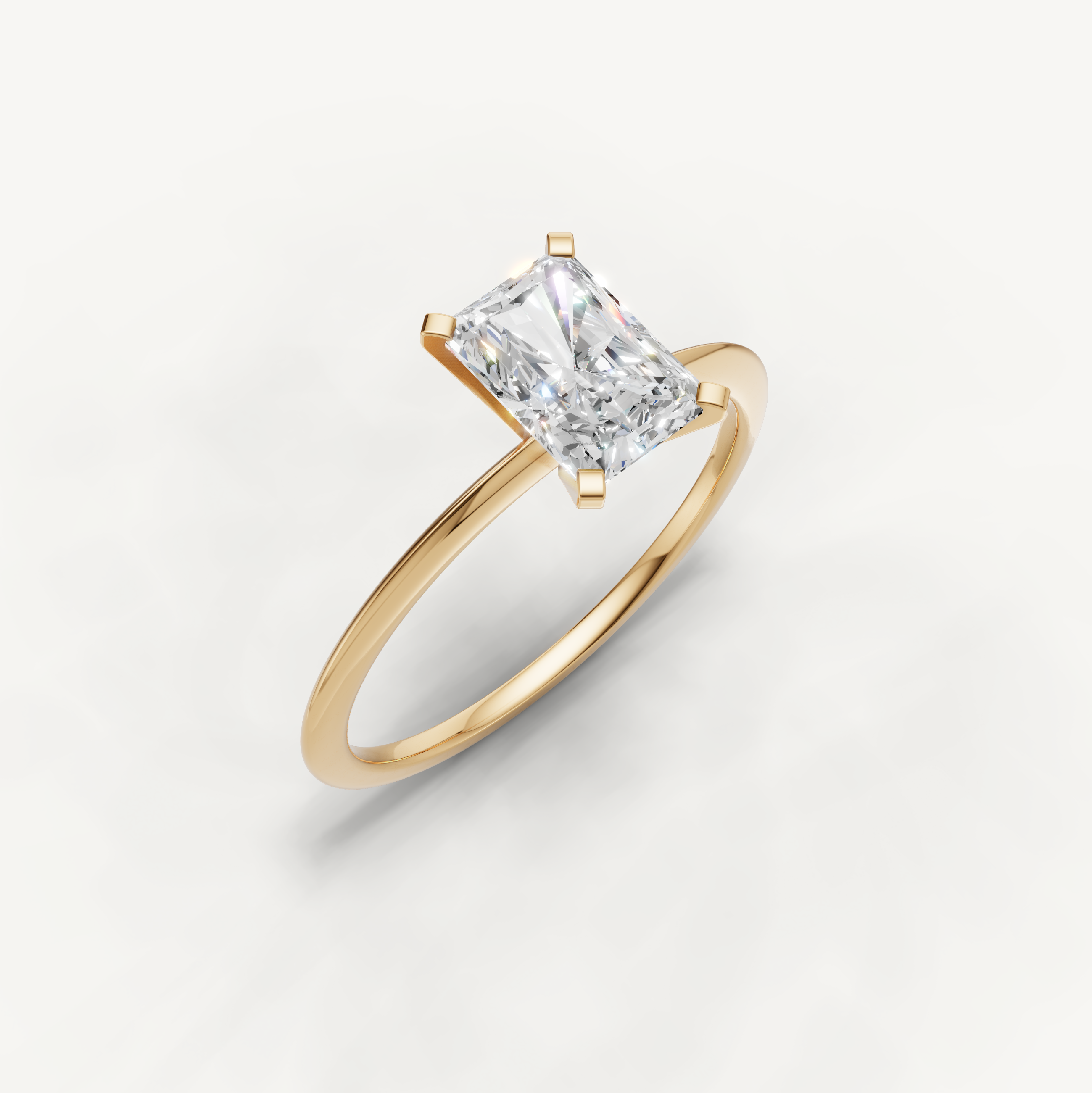 Elegant radiant cut yellow gold solitaire ring for women by Raul Diamonds