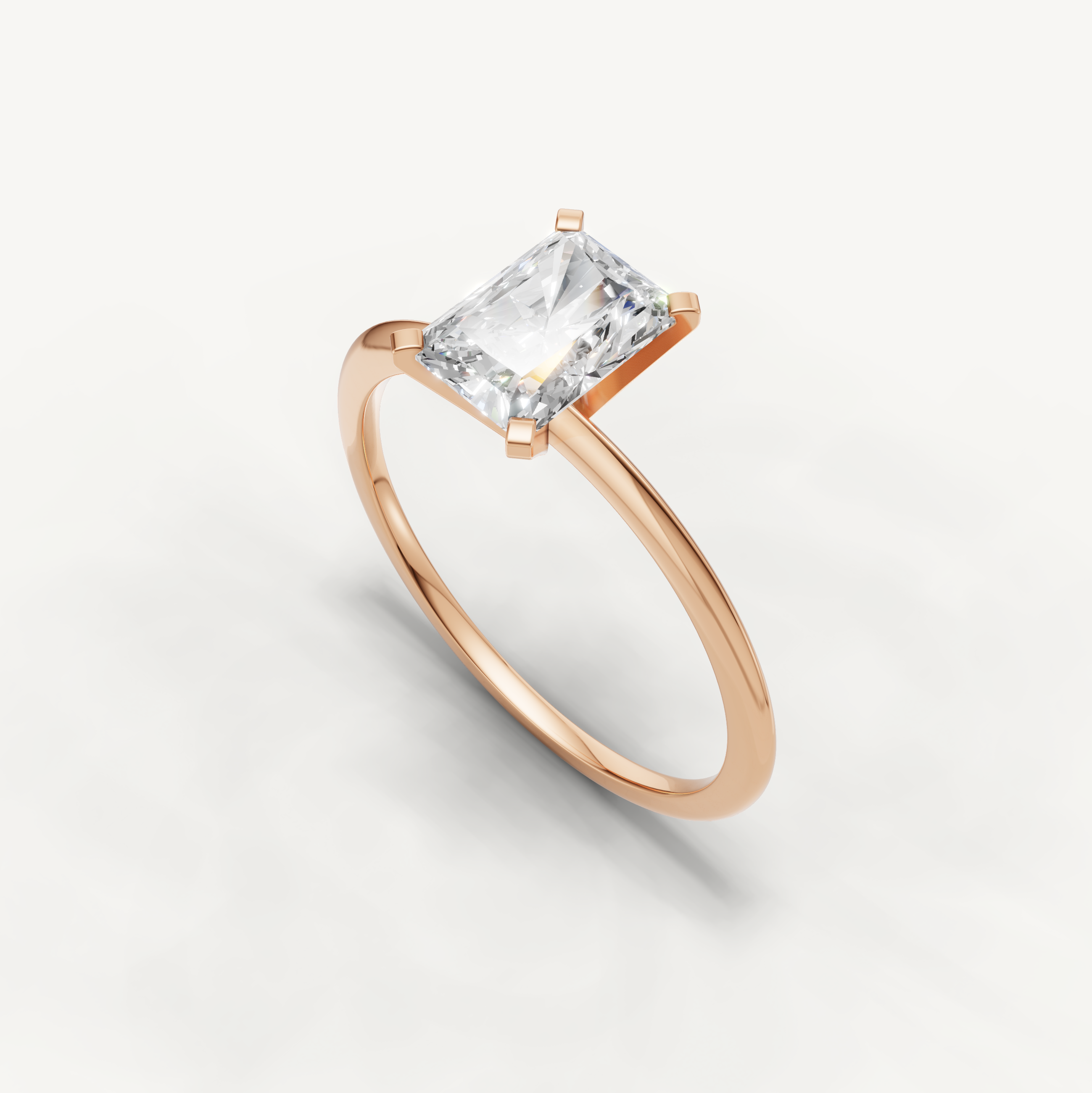 Thin band radiant cut solitaire ring in rose gold by Raul Diamonds