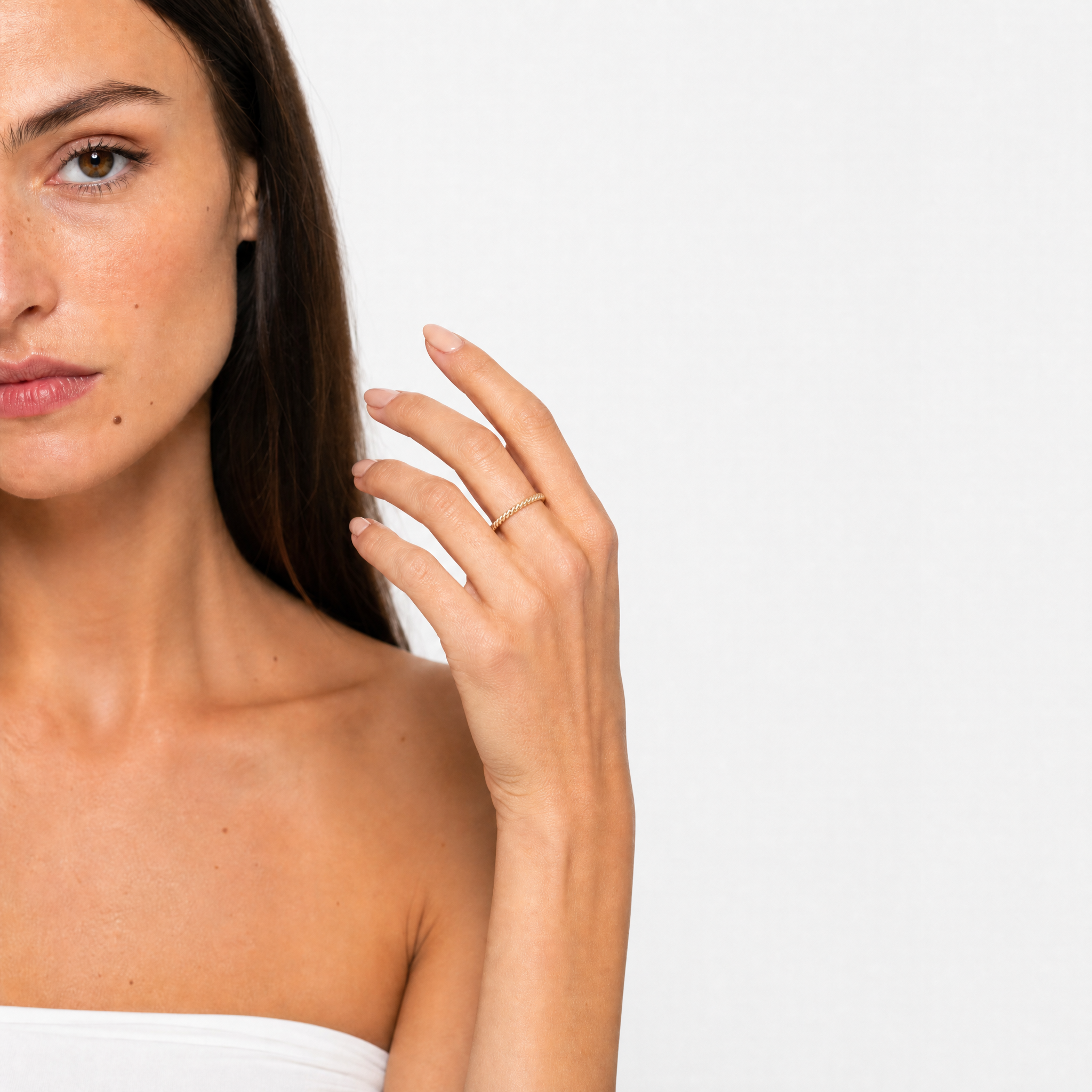 Model wearing Raul Diamonds yellow gold twisted stackable wedding band with polished plain gold design for everyday wear and bridal stacking style