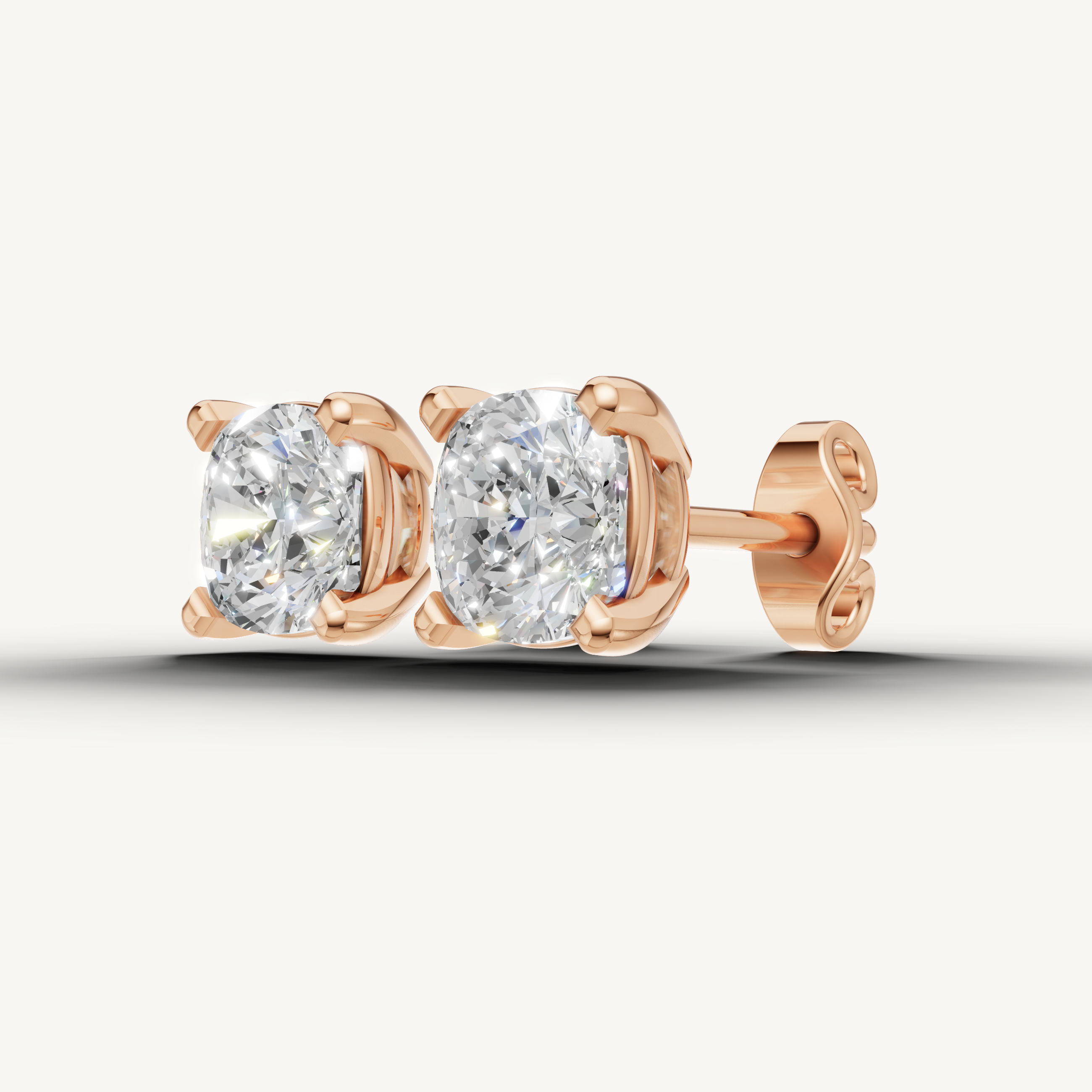 Elegant rose gold cushion diamond earrings with brilliant shine by Raul Diamonds