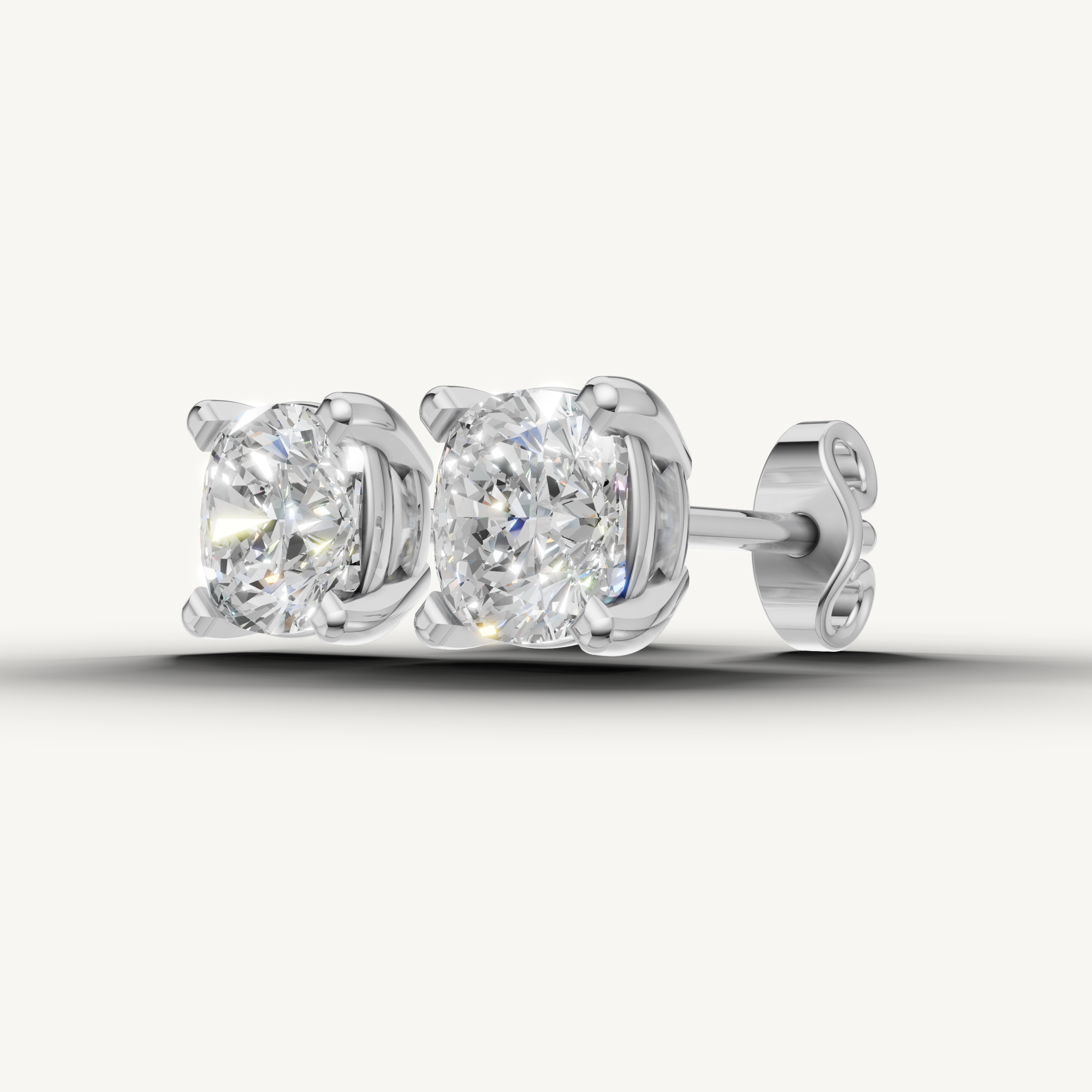 Elegant white gold cushion diamond earrings with timeless beauty by Raul Diamonds