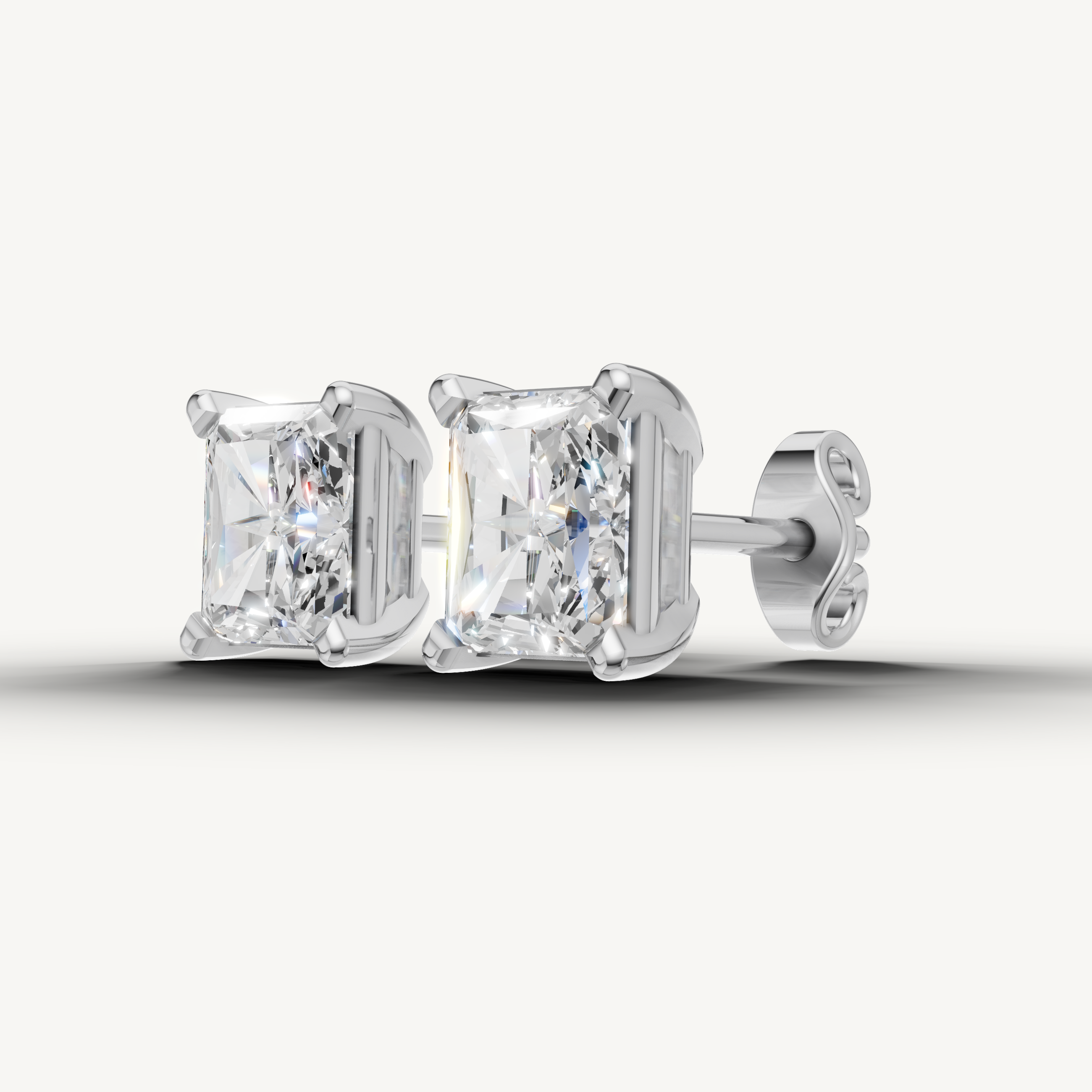 Elegant white gold radiant diamond earrings with sparkling beauty by Raul Diamonds