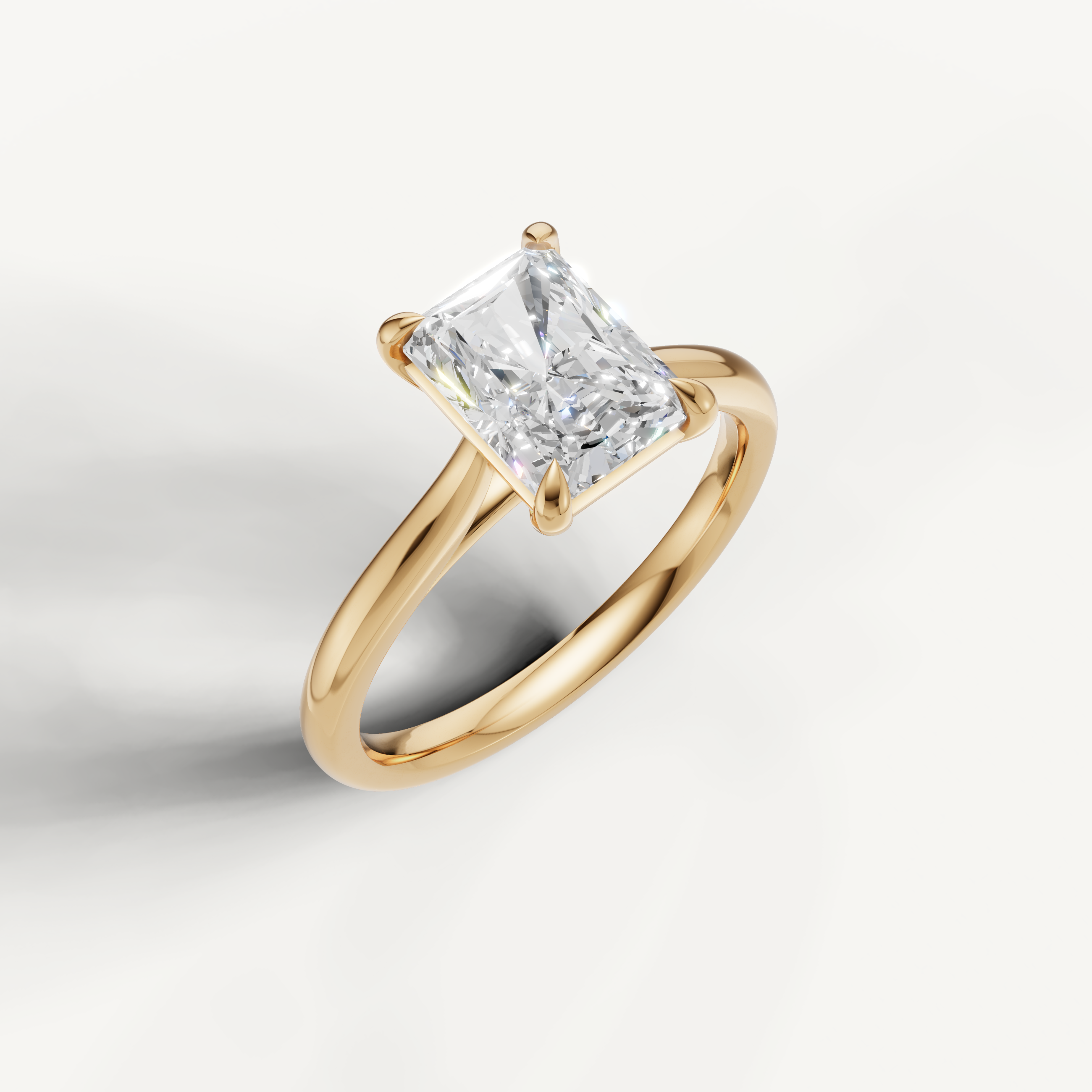 Luxury radiant cut diamond ring in yellow gold by Raul Diamonds for modern brides