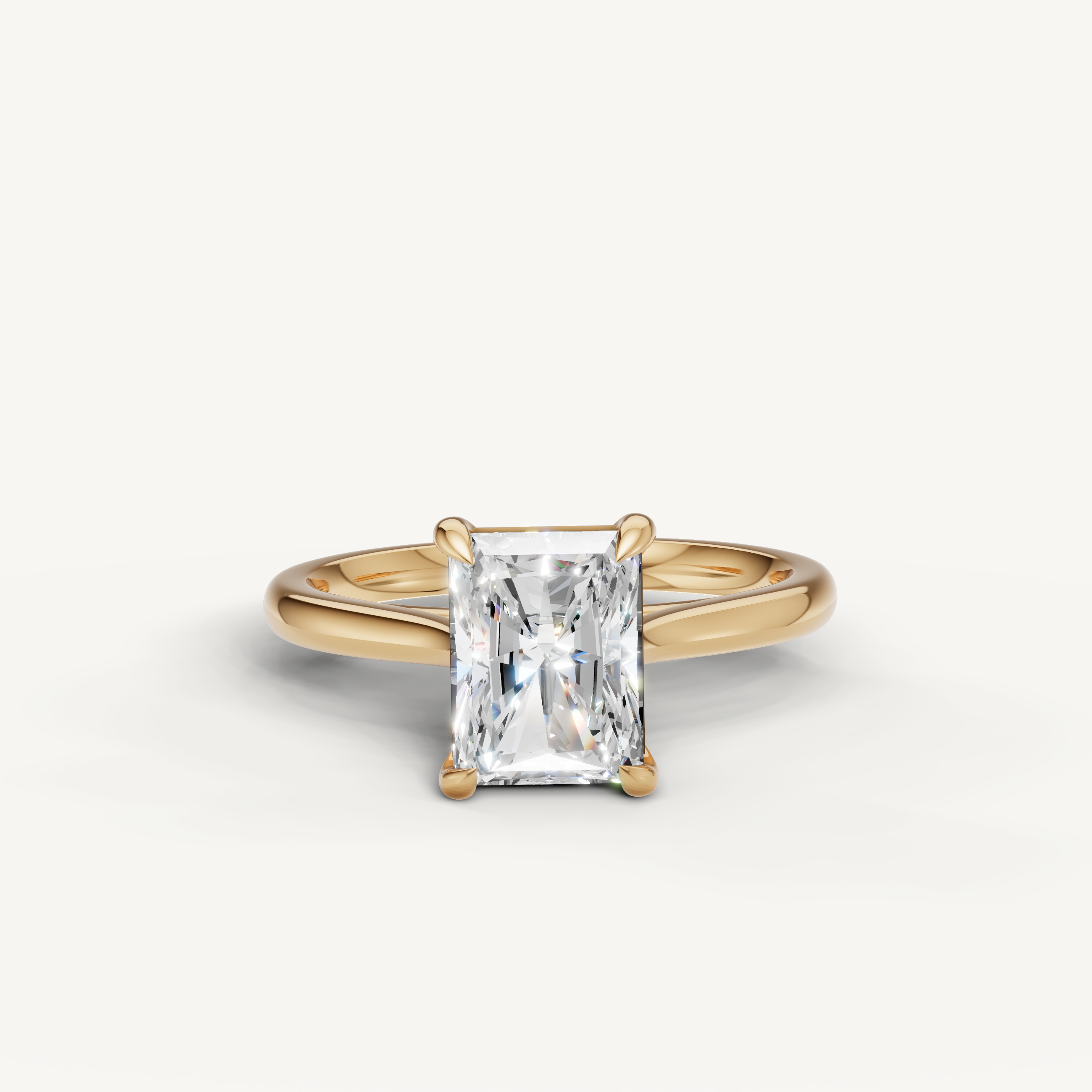 Raul Diamonds radiant cut solitaire engagement ring in yellow gold with sleek polished band