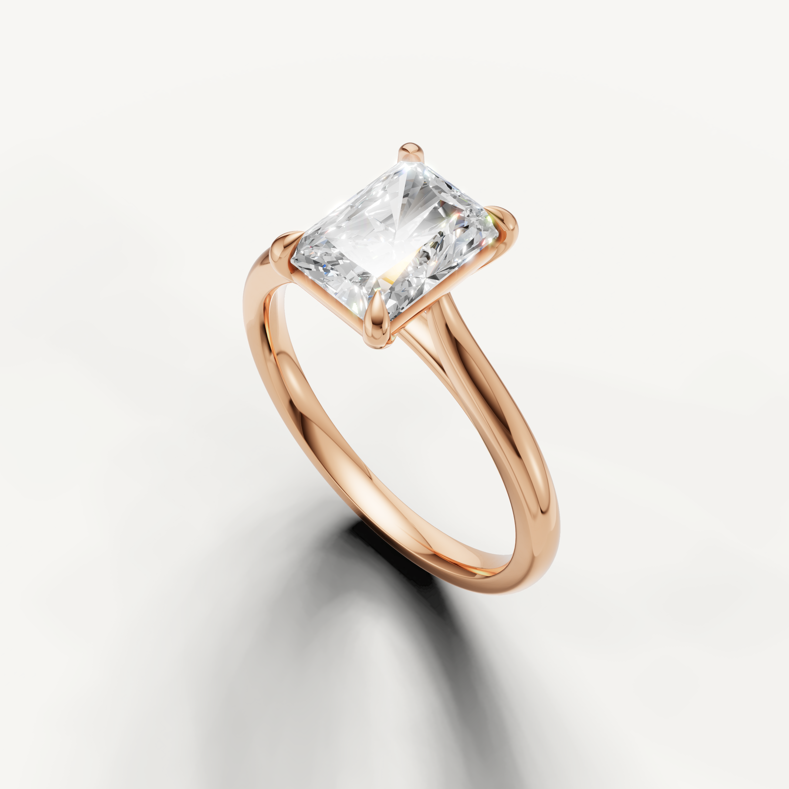 Modern radiant cut rose gold engagement ring from Raul Diamonds fine jewelry collection