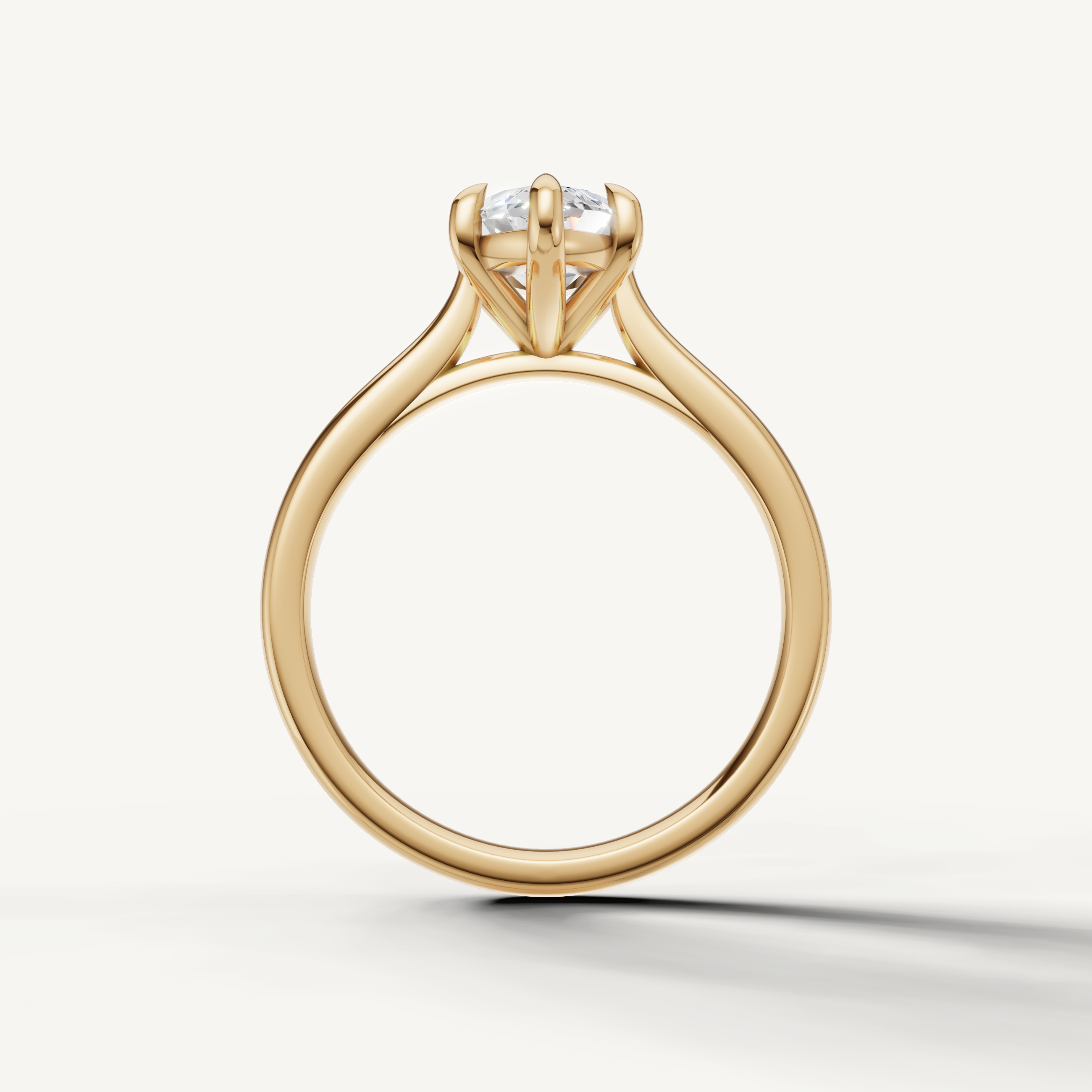 Raul Diamonds handcrafted marquise cut yellow gold solitaire ring with classic four prong setting