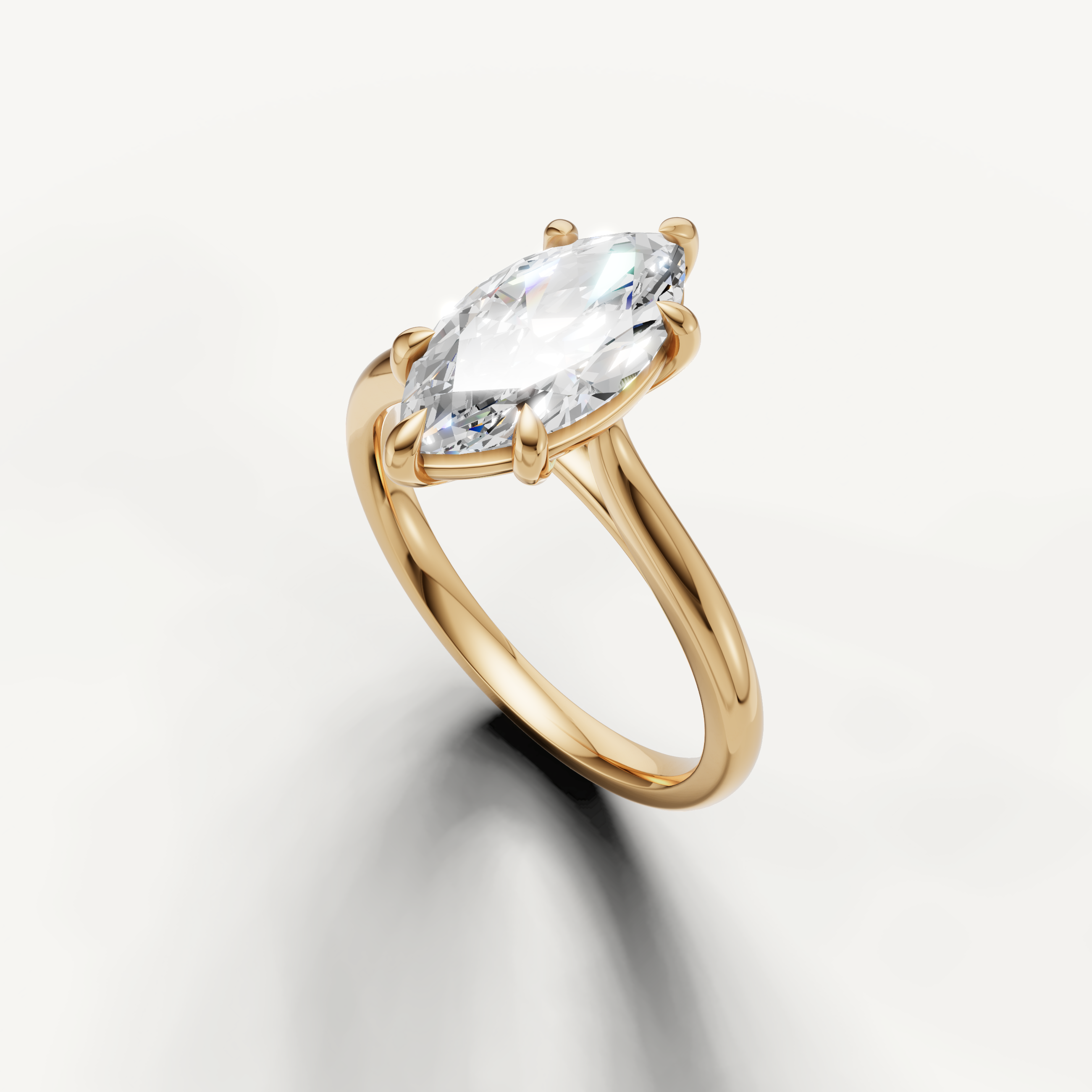 Elegant yellow gold marquise engagement ring featuring elongated diamond brilliance by Raul Diamonds