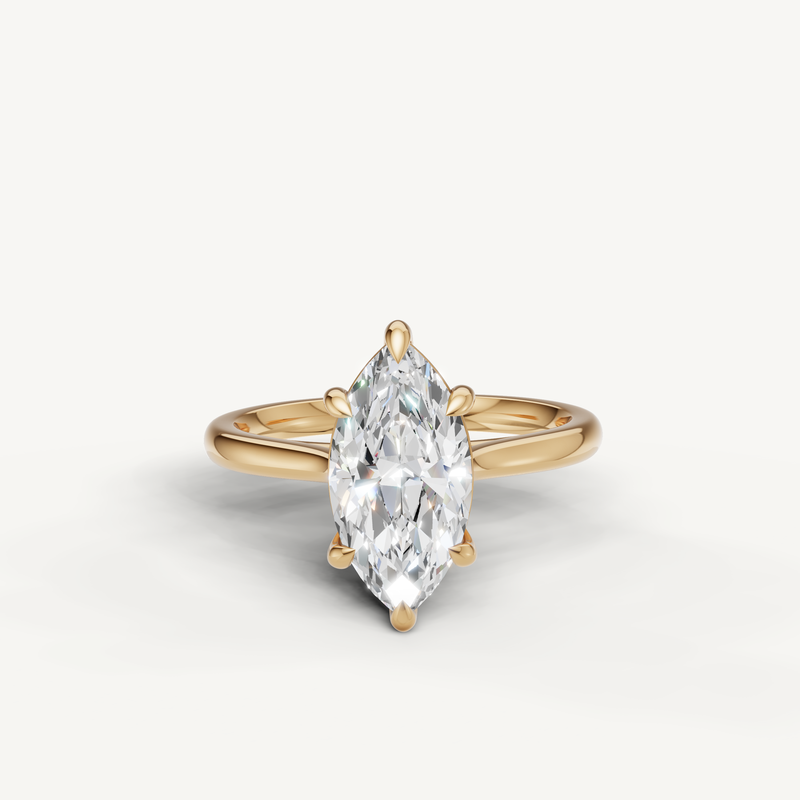 Raul Diamonds marquise cut solitaire engagement ring in yellow gold with elegant tapered band