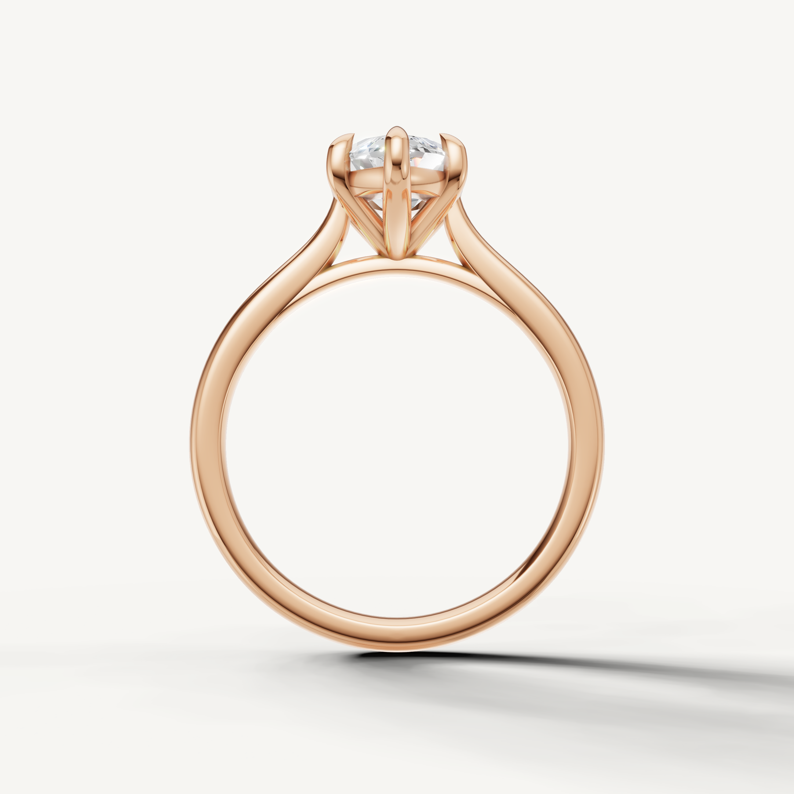 Elegant rose gold marquise solitaire ring with sparkling center diamond by Raul Diamonds