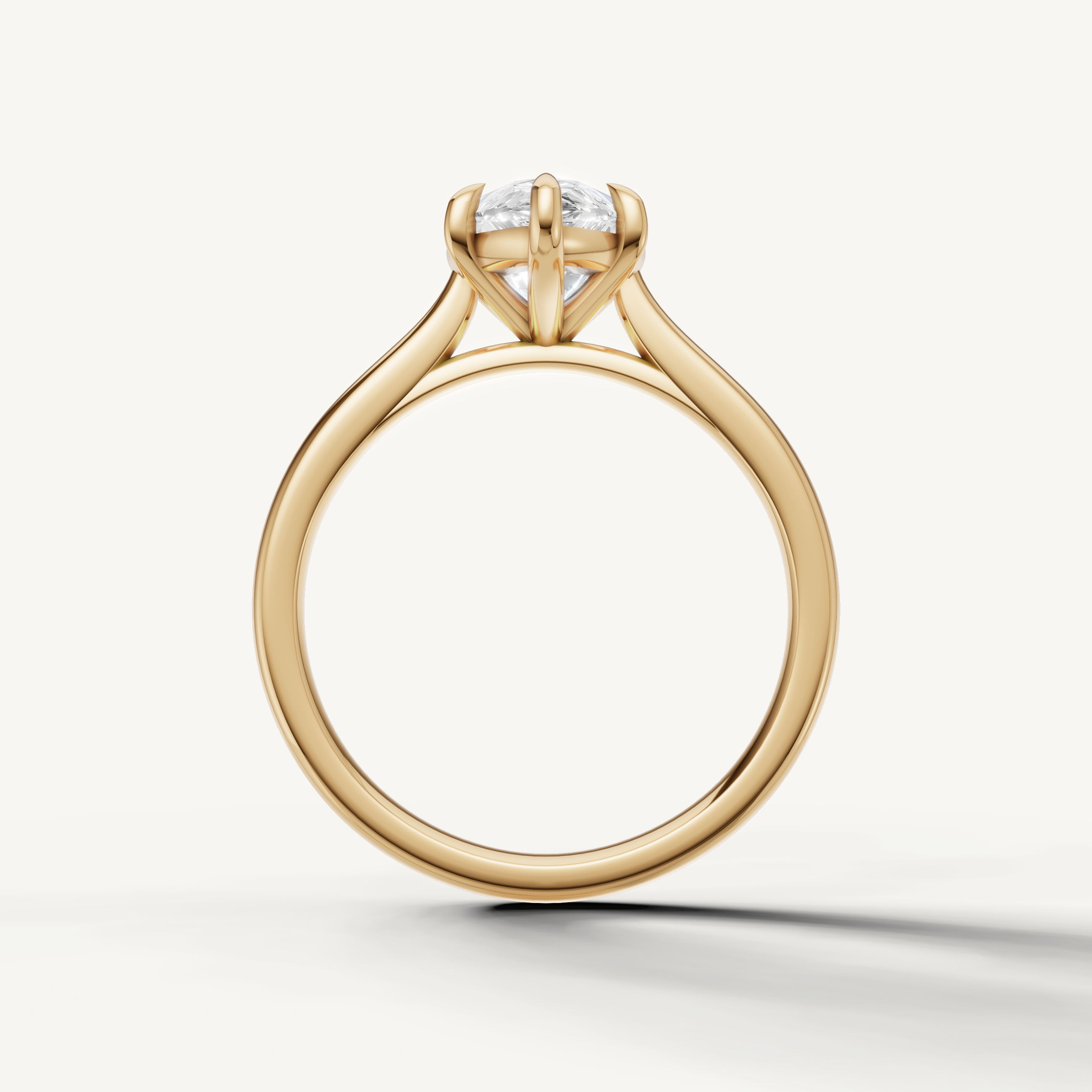 Raul Diamonds handcrafted pear cut yellow gold solitaire ring with classic prong setting