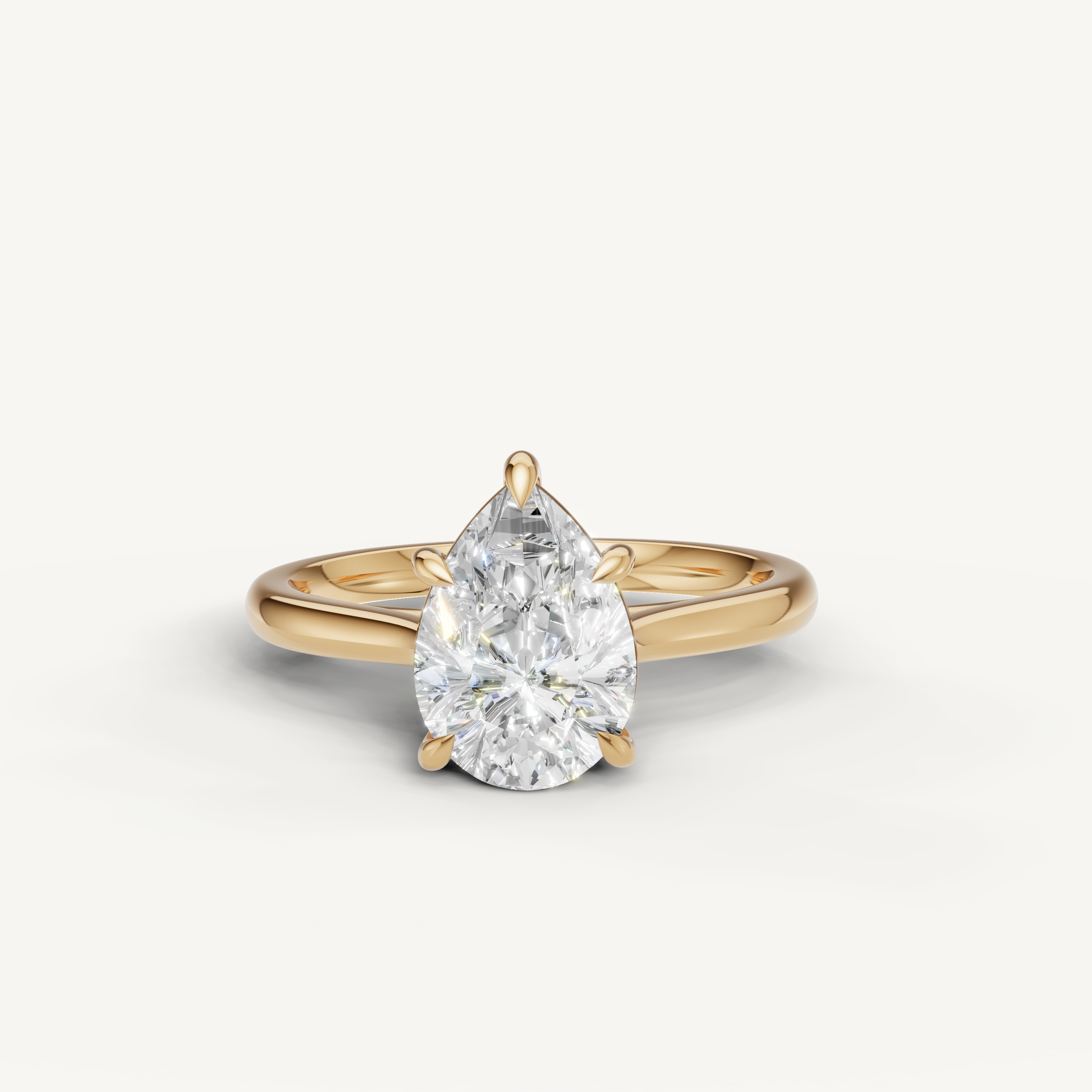 Raul Diamonds pear cut solitaire engagement ring in yellow gold with elegant polished band