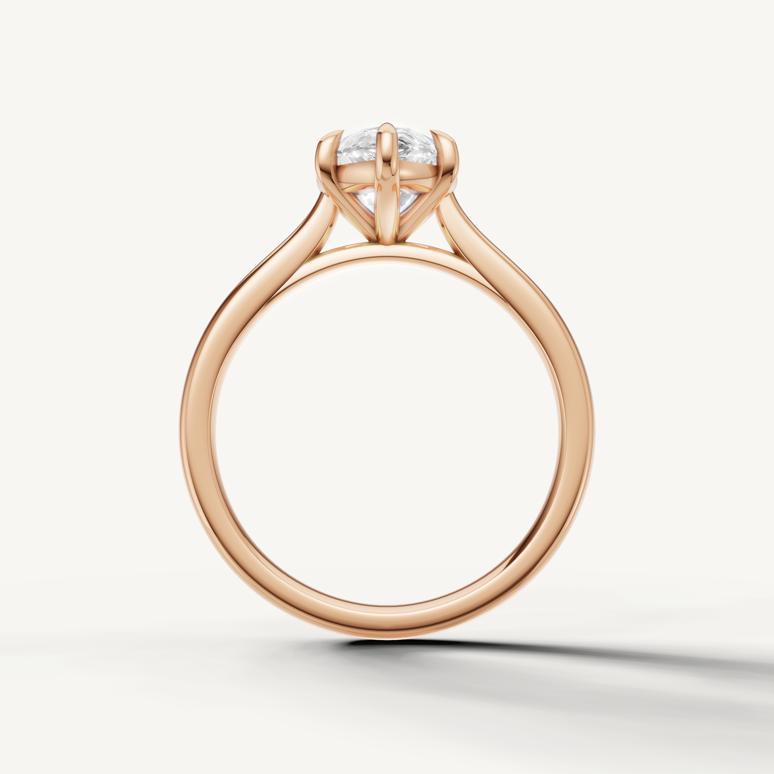 Elegant rose gold pear solitaire ring with sparkling center diamond by Raul Diamonds
