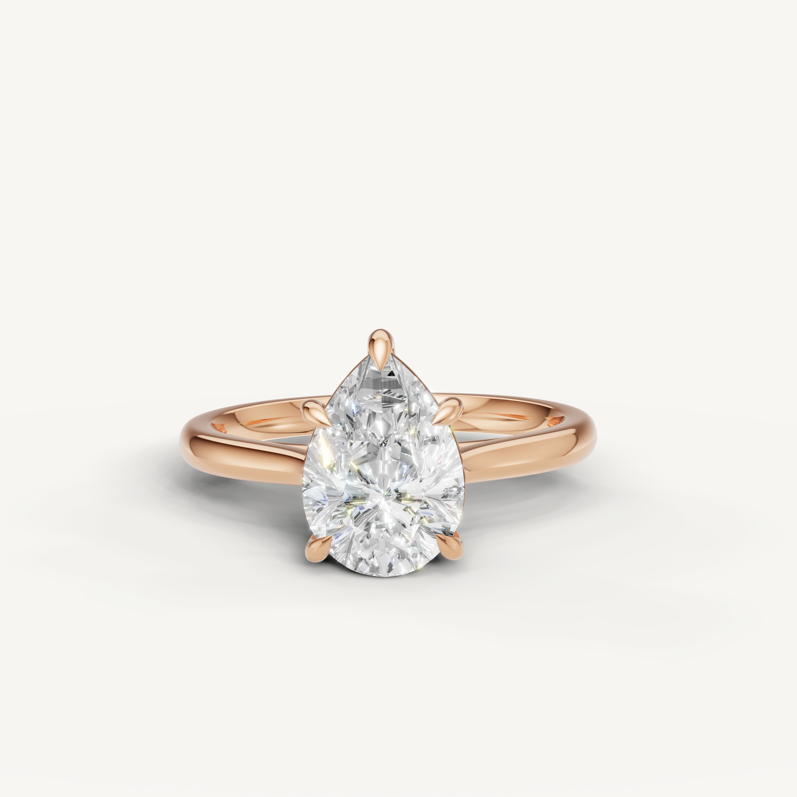 Raul Diamonds pear cut engagement ring in rose gold with romantic solitaire styling