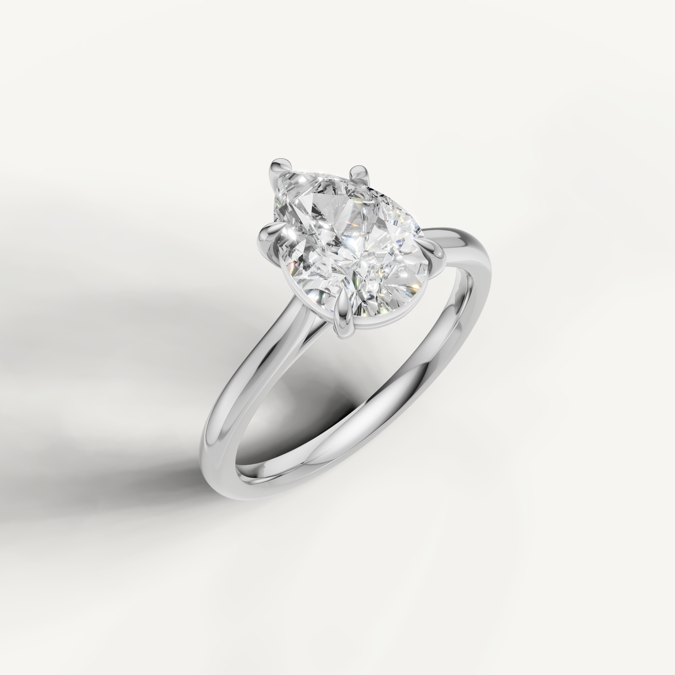 White gold pear shaped diamond ring by Raul Diamonds with minimalist luxury design