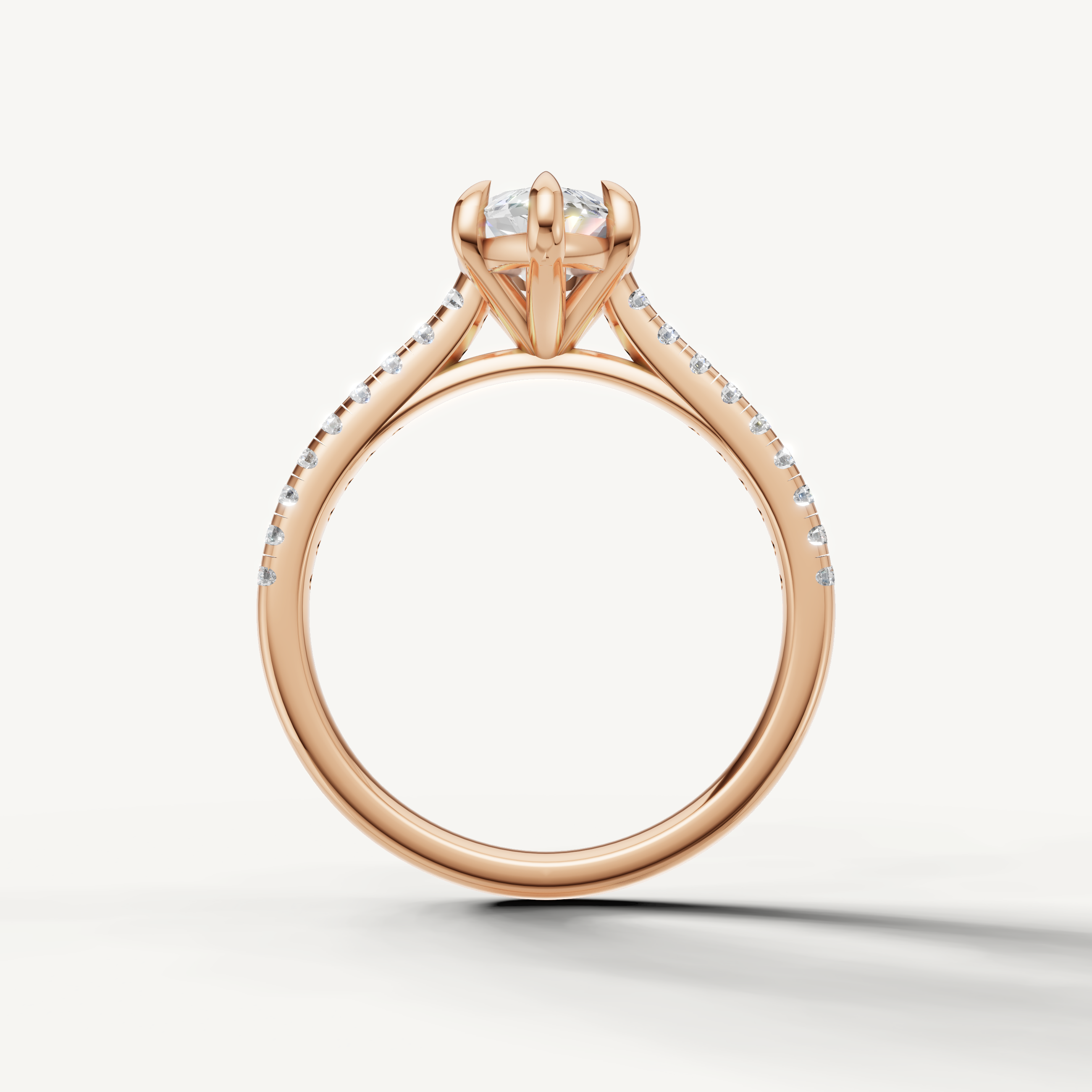 Modern rose gold marquise solitaire ring with shimmering side diamonds by Raul Diamonds