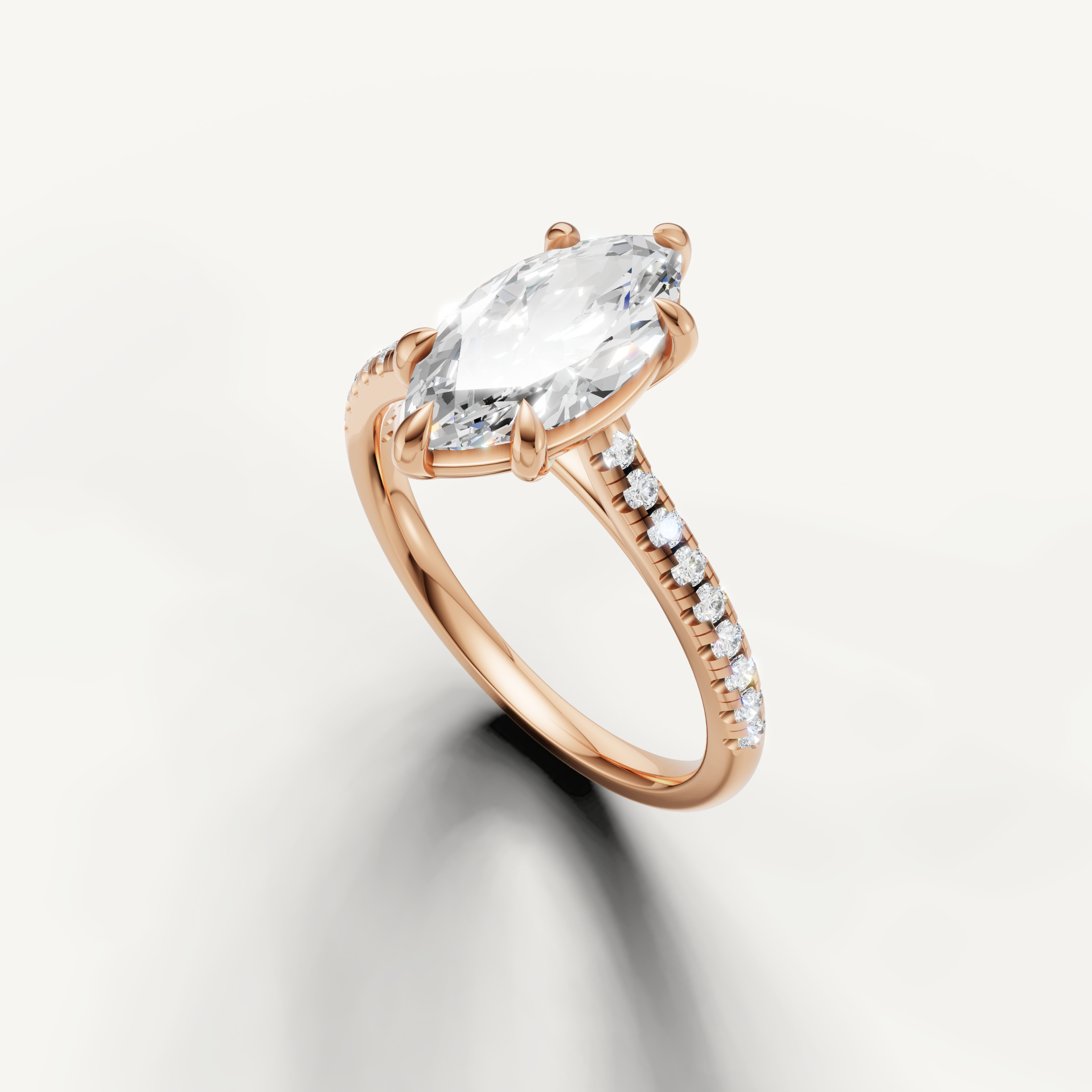 Luxury marquise cut rose gold engagement ring with diamond pavé band by Raul Diamonds
