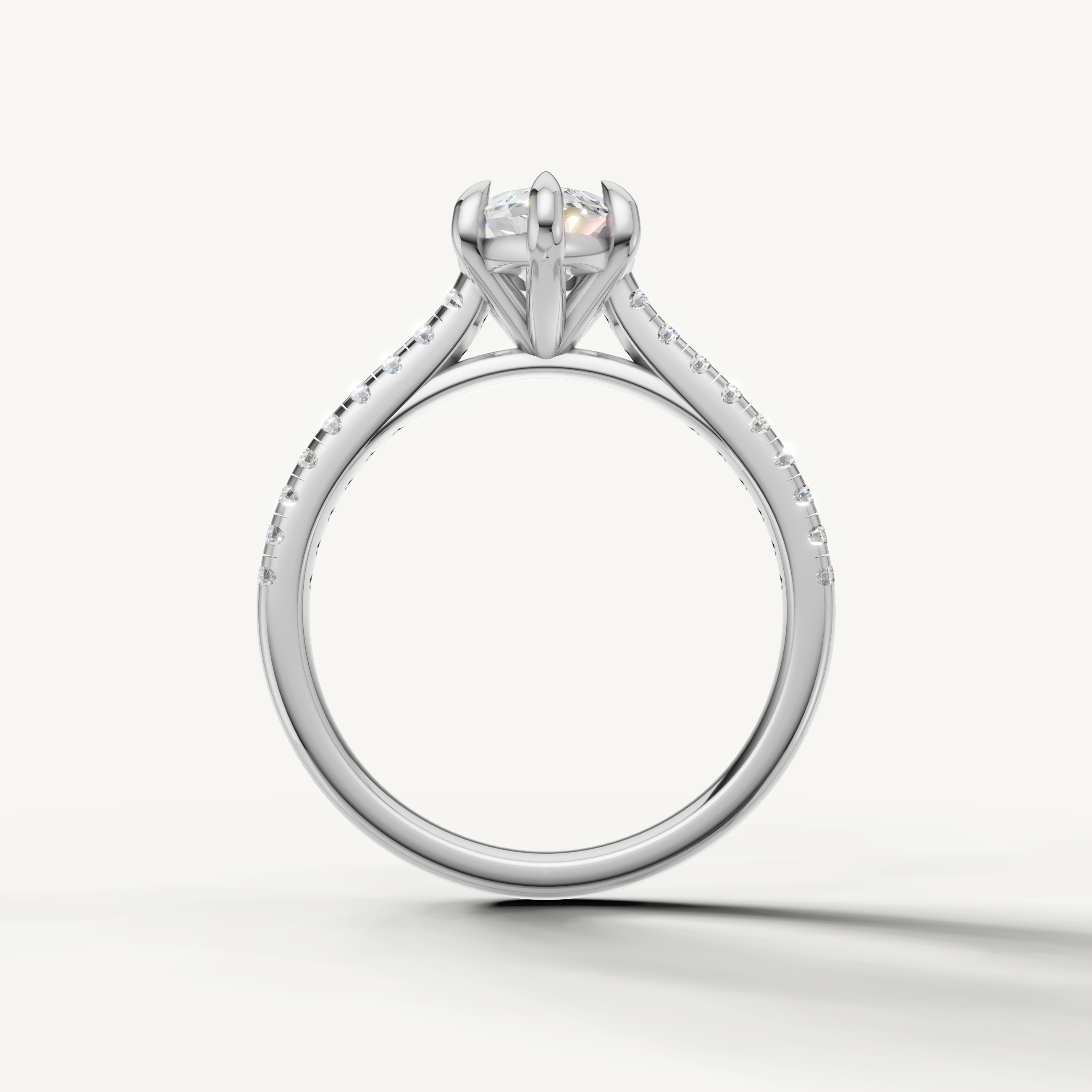 Elegant white gold marquise solitaire ring with diamond accented band by Raul Diamonds