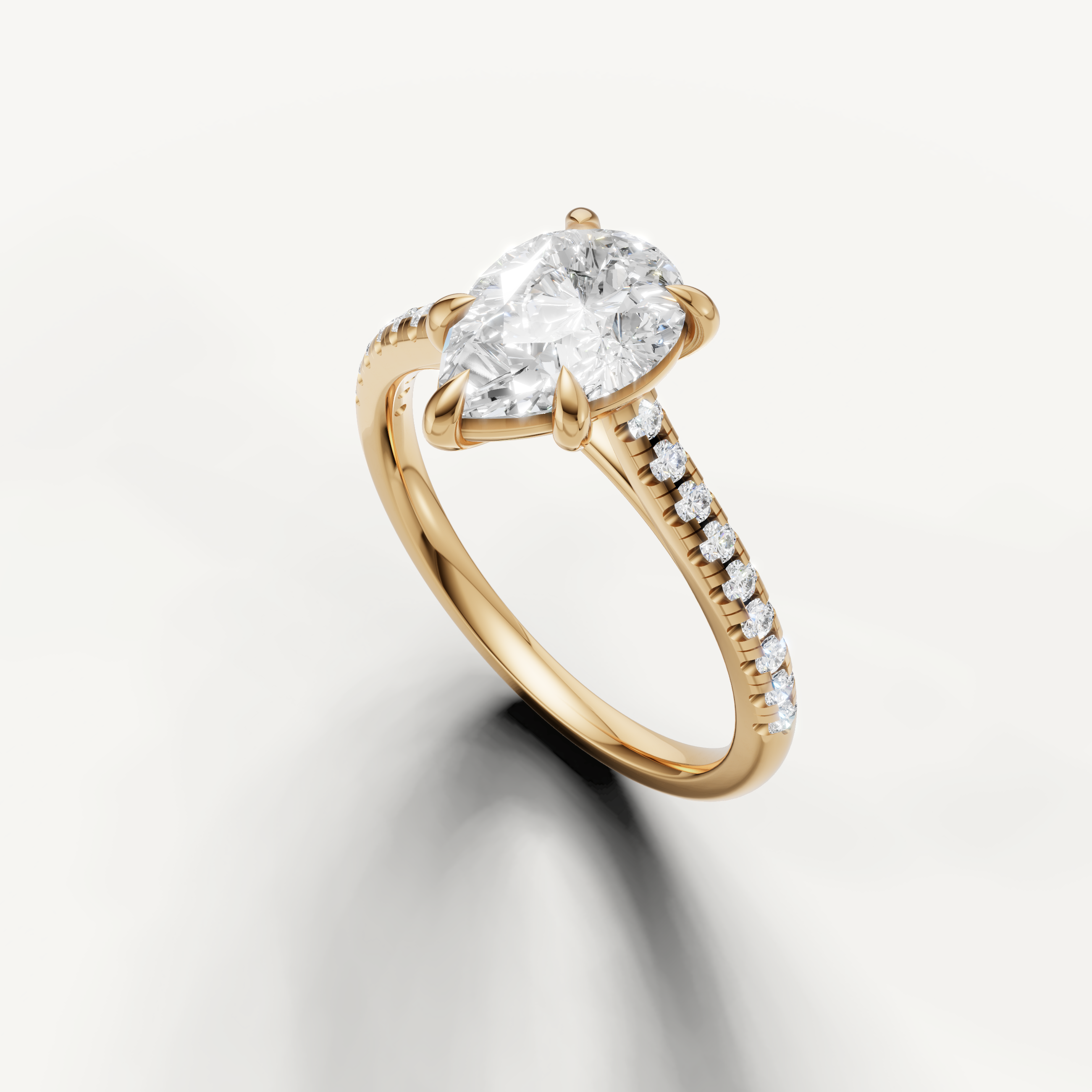 Yellow gold pear diamond engagement ring featuring brilliant solitaire center stone by Raul Diamonds