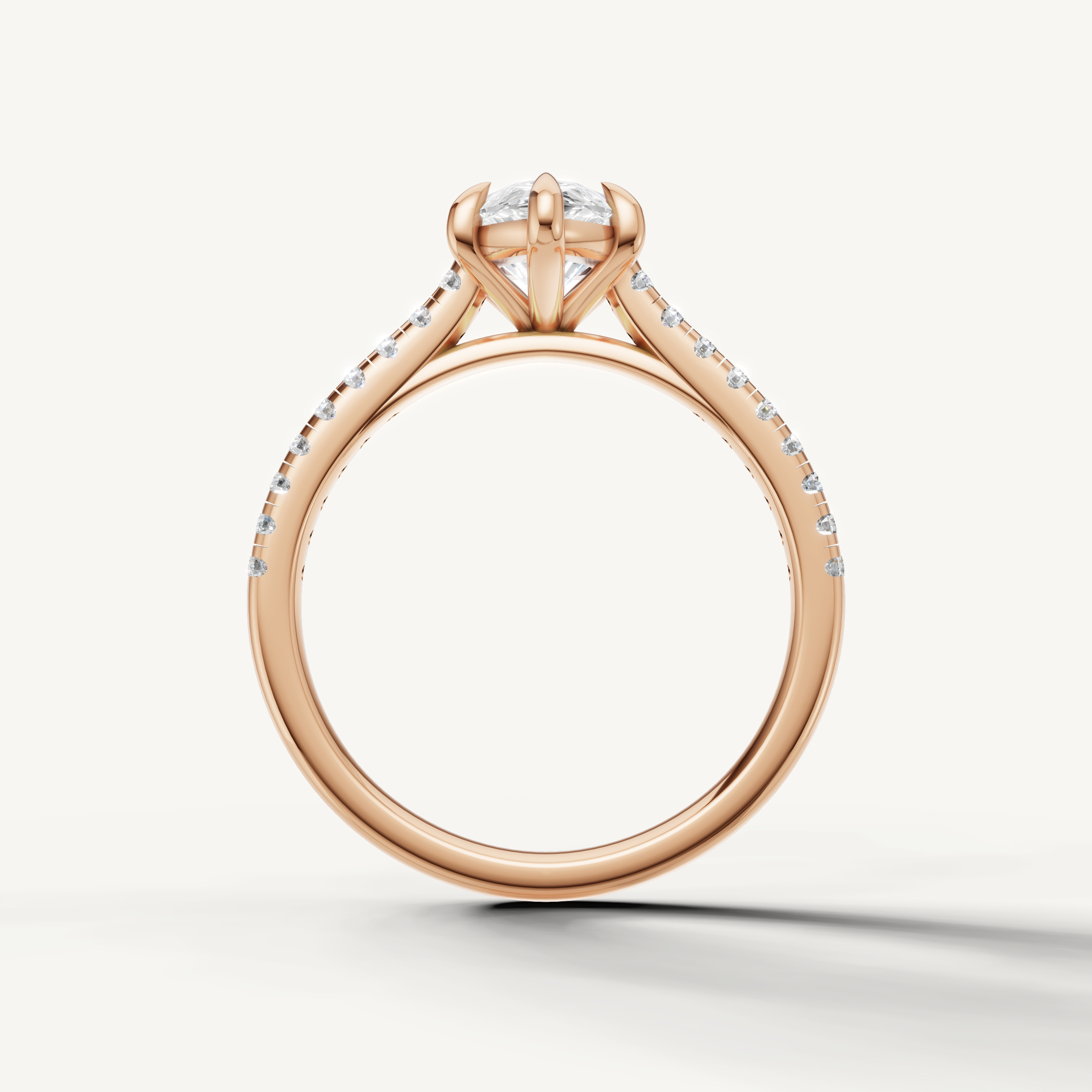 Luxury pear cut diamond engagement ring in rose gold handcrafted by Raul Diamonds