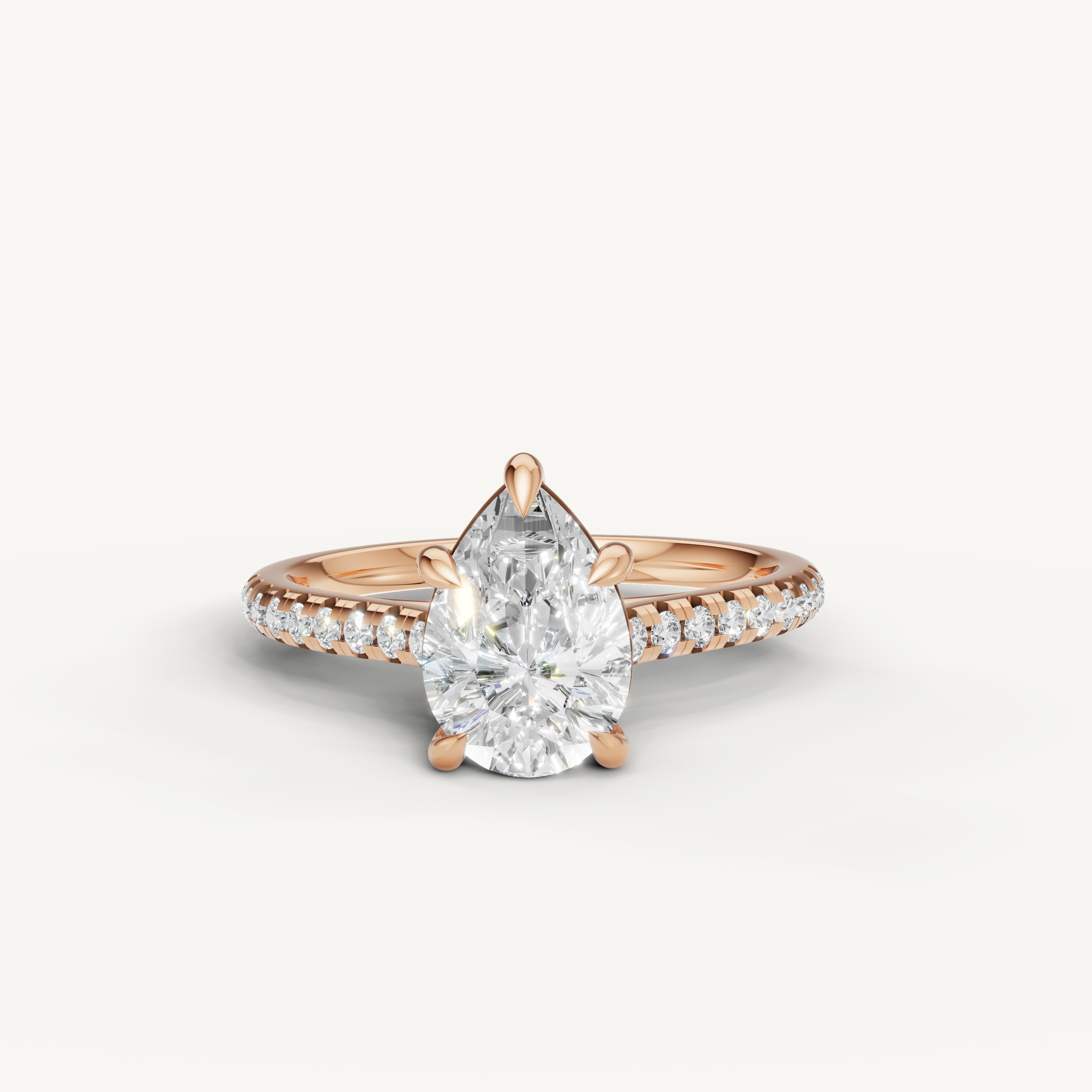 Raul Diamonds pear cut engagement ring in rose gold with pavé diamond band and pear solitaire diamond