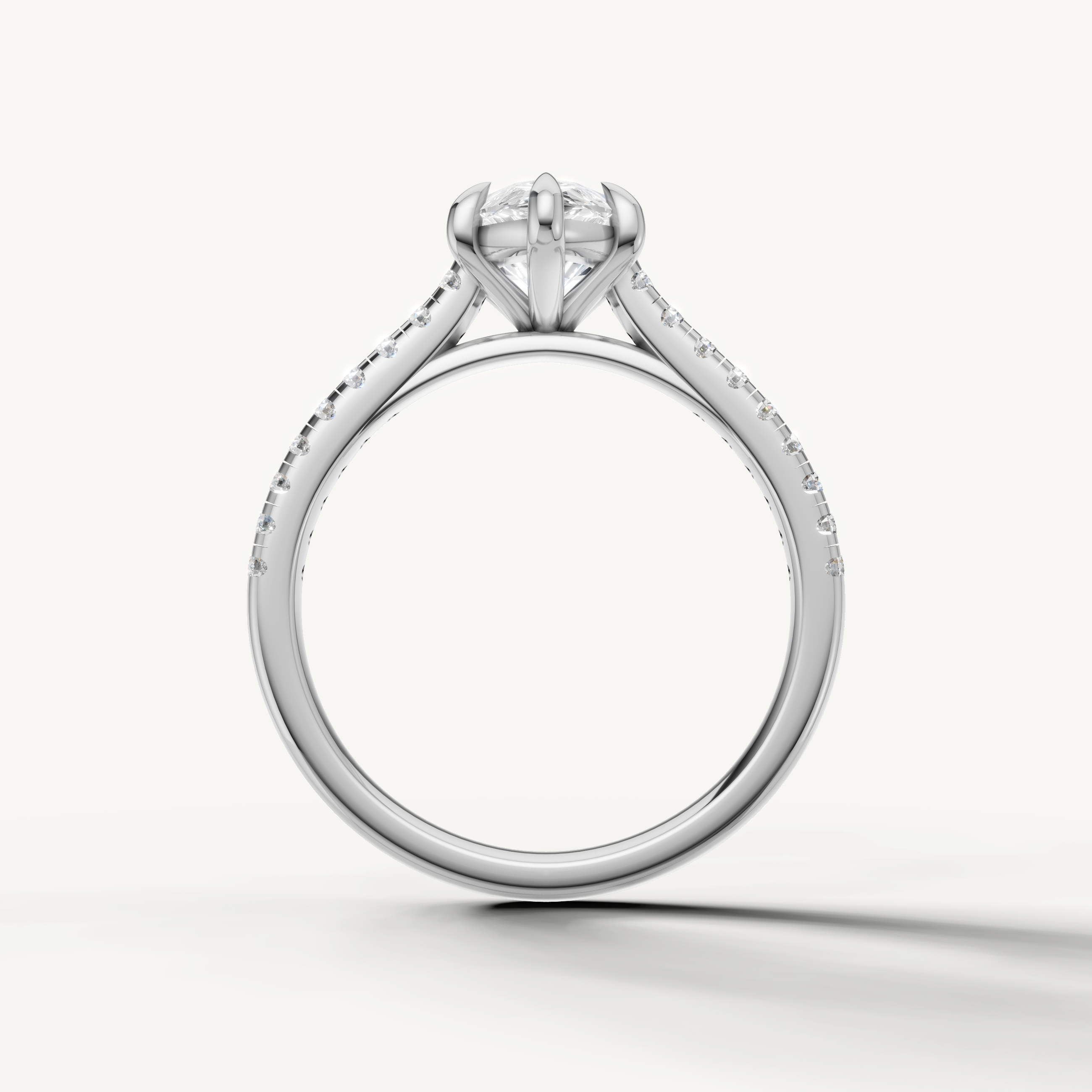 Luxury pear solitaire diamond ring in white gold with pavé band by Raul Diamonds