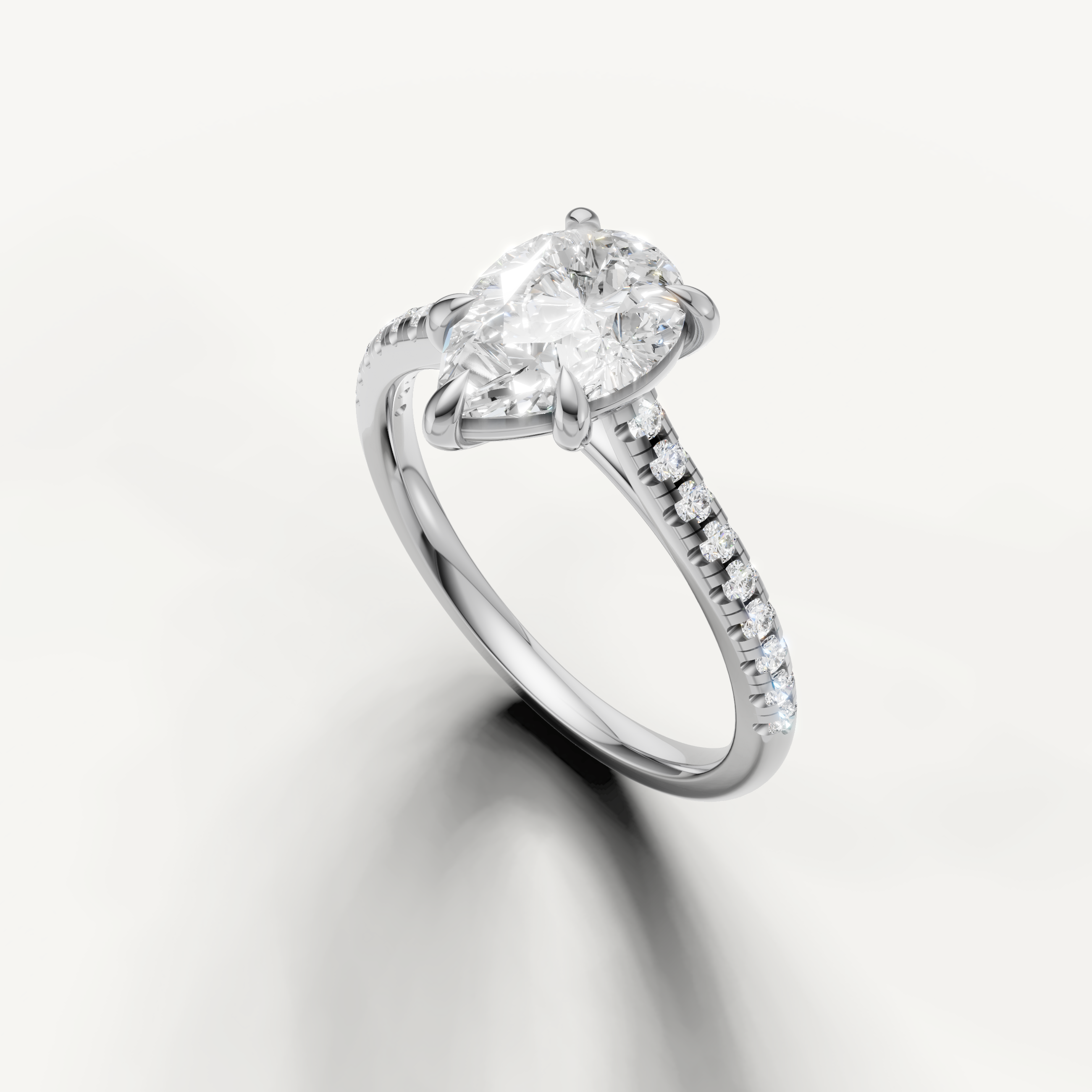 Elegant white gold pear diamond engagement ring handcrafted by Raul Diamonds
