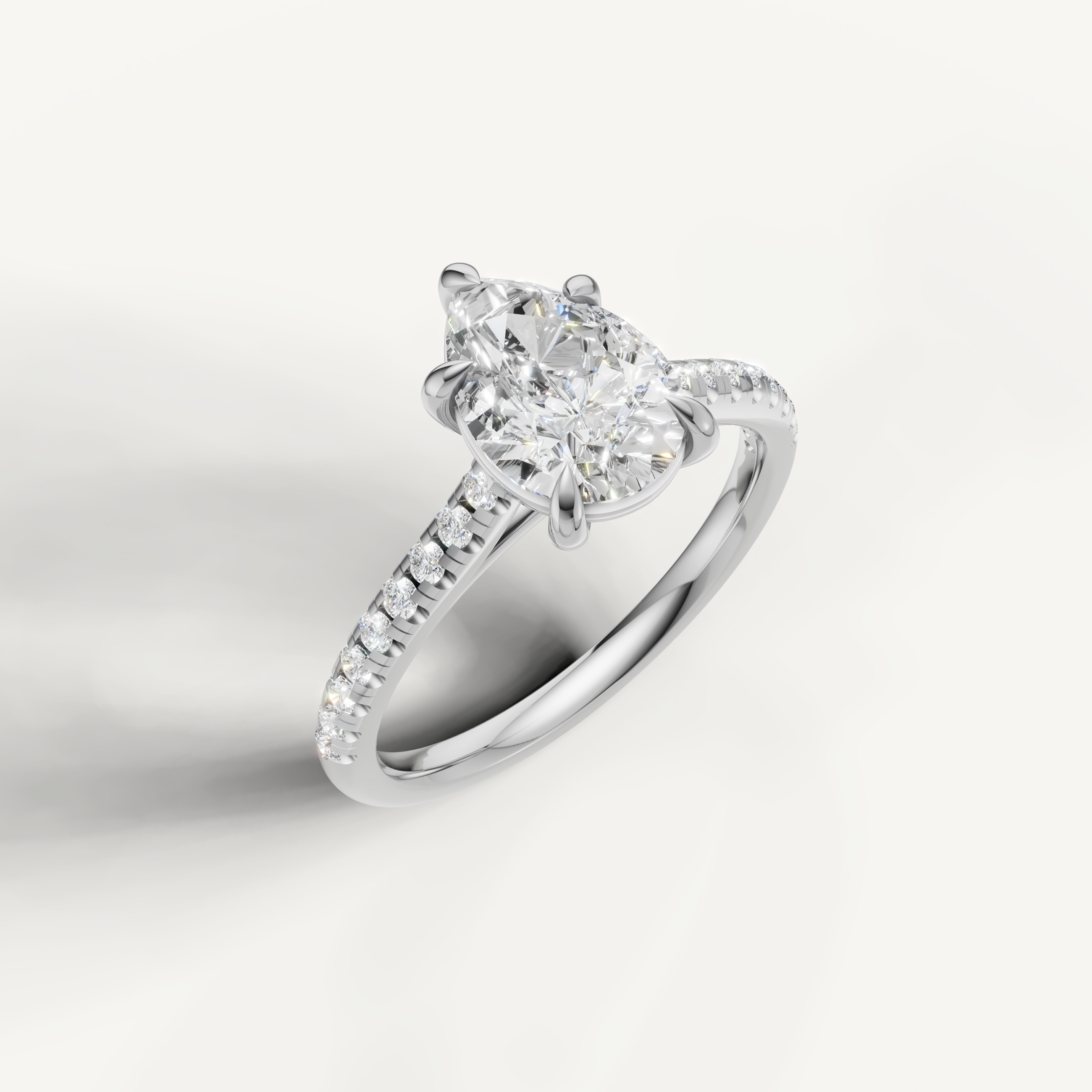 White gold pear cut diamond ring with sparkling pavé setting by Raul Diamonds