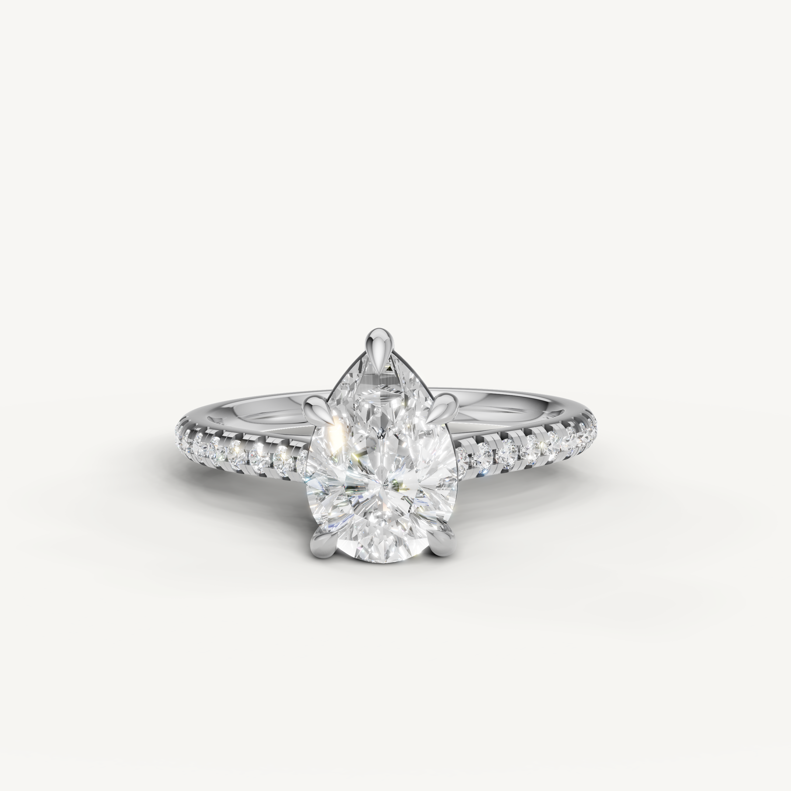 Raul Diamonds pear shaped engagement ring in white gold with pavé diamond band and solitaire diamond