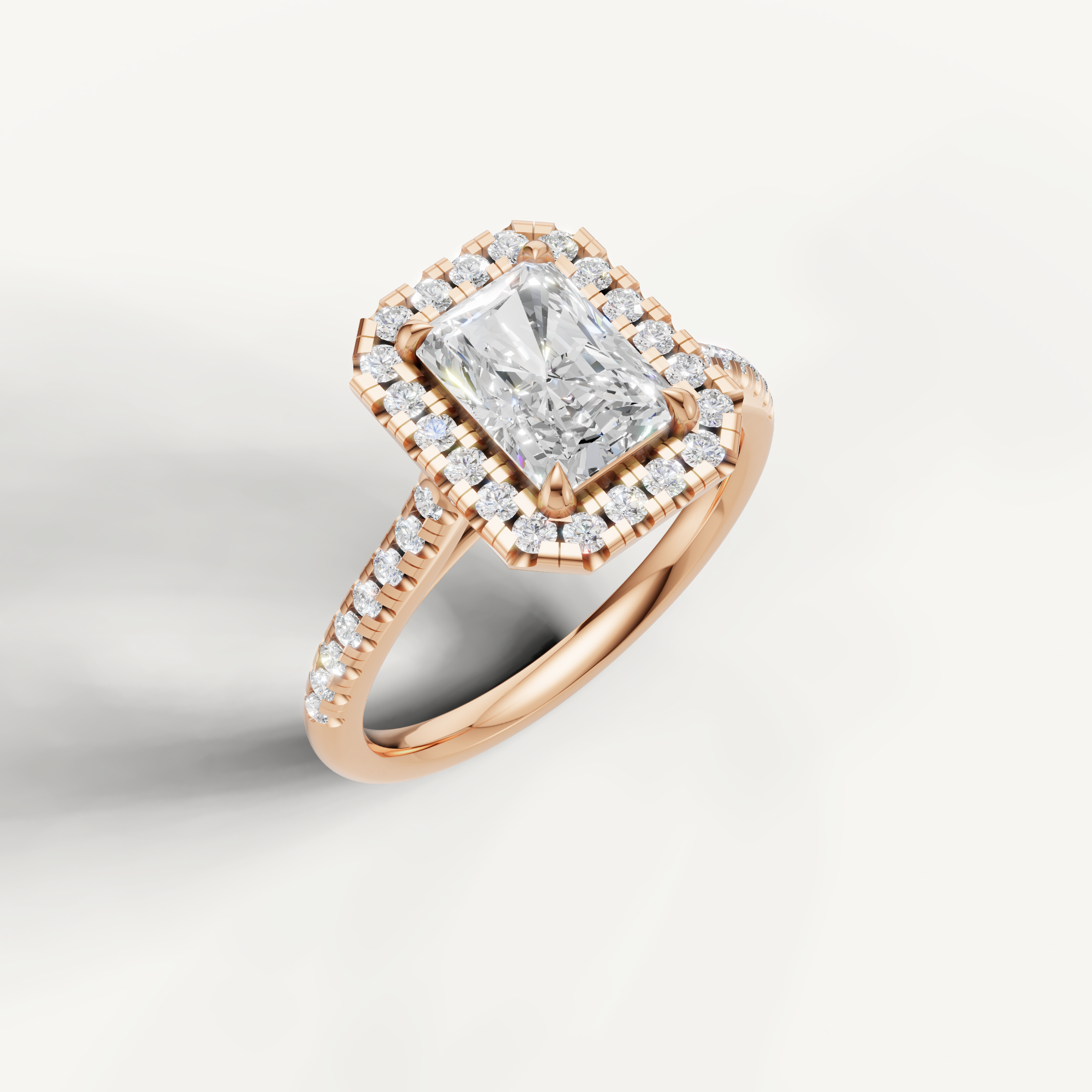 Romantic rose gold radiant diamond halo ring handcrafted by Raul Diamonds