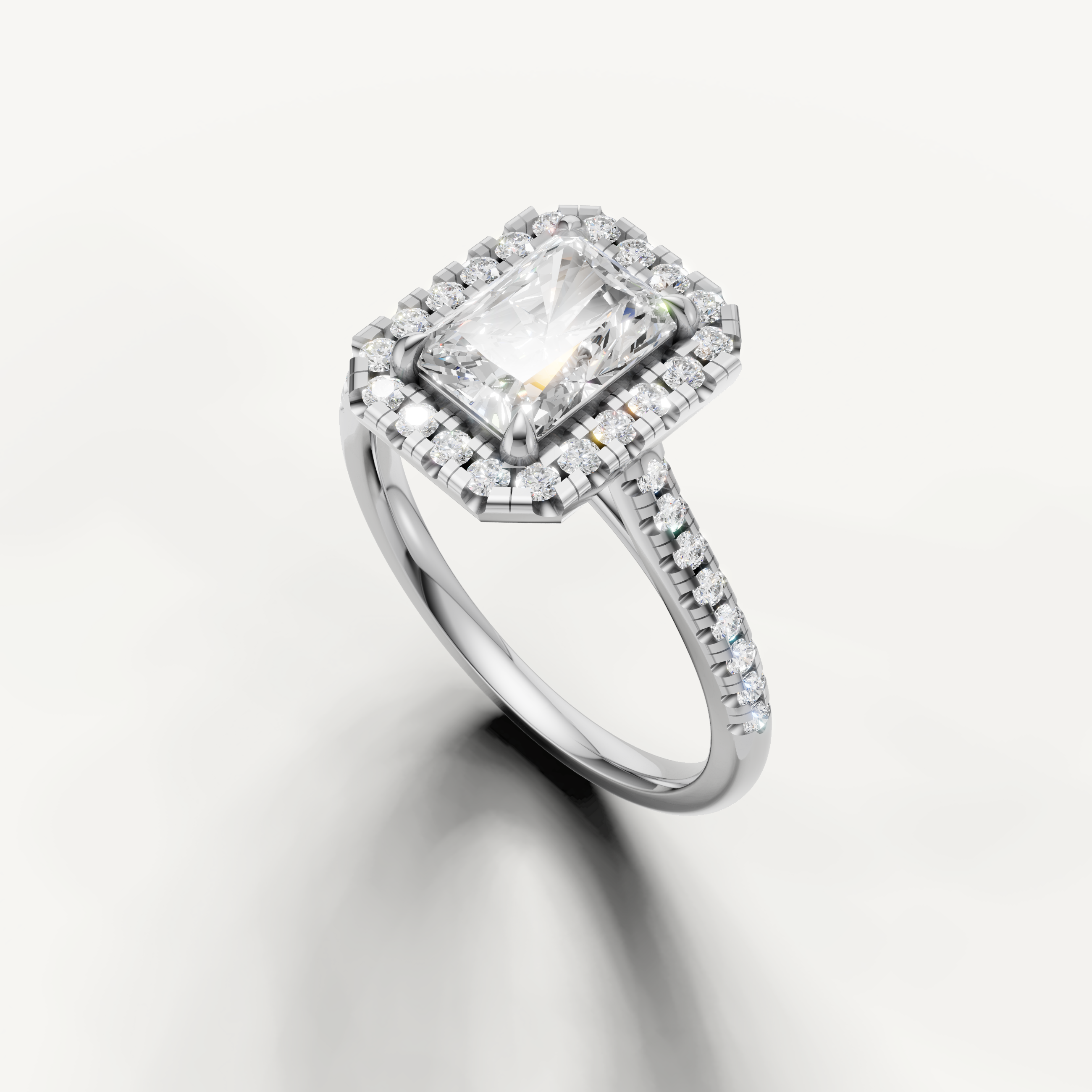 Elegant white gold radiant cut engagement ring with halo setting from Raul Diamonds