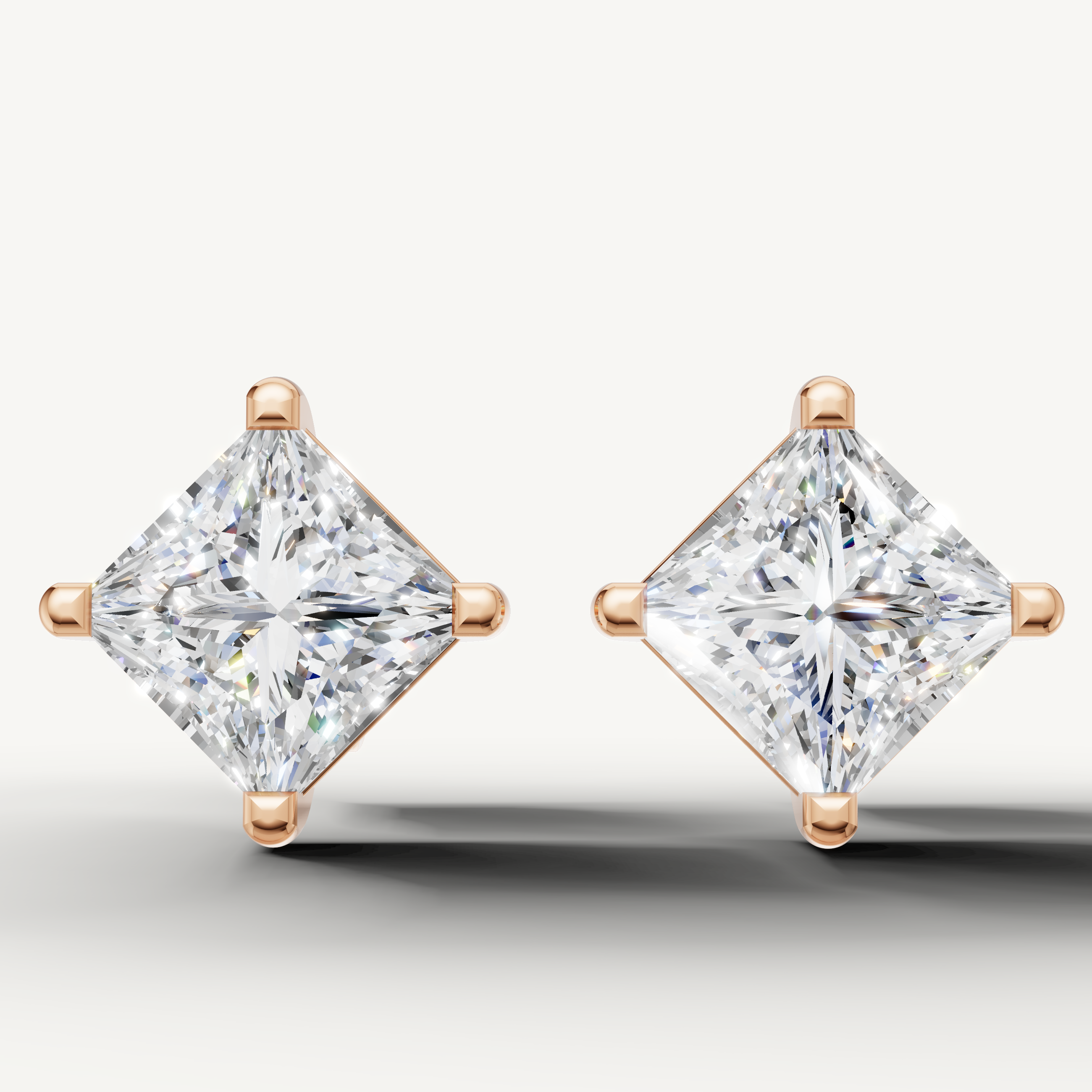 Princess cut lab grown diamond stud earrings in 14K rose gold by Raul Diamonds