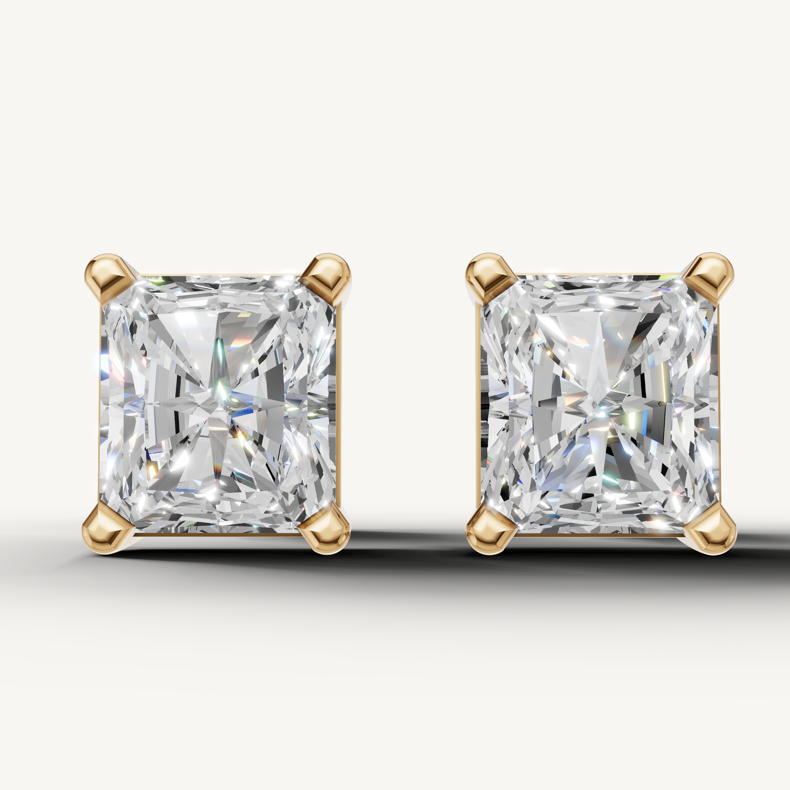 Radiant cut lab grown diamond stud earrings in 14K yellow gold by Raul Diamonds