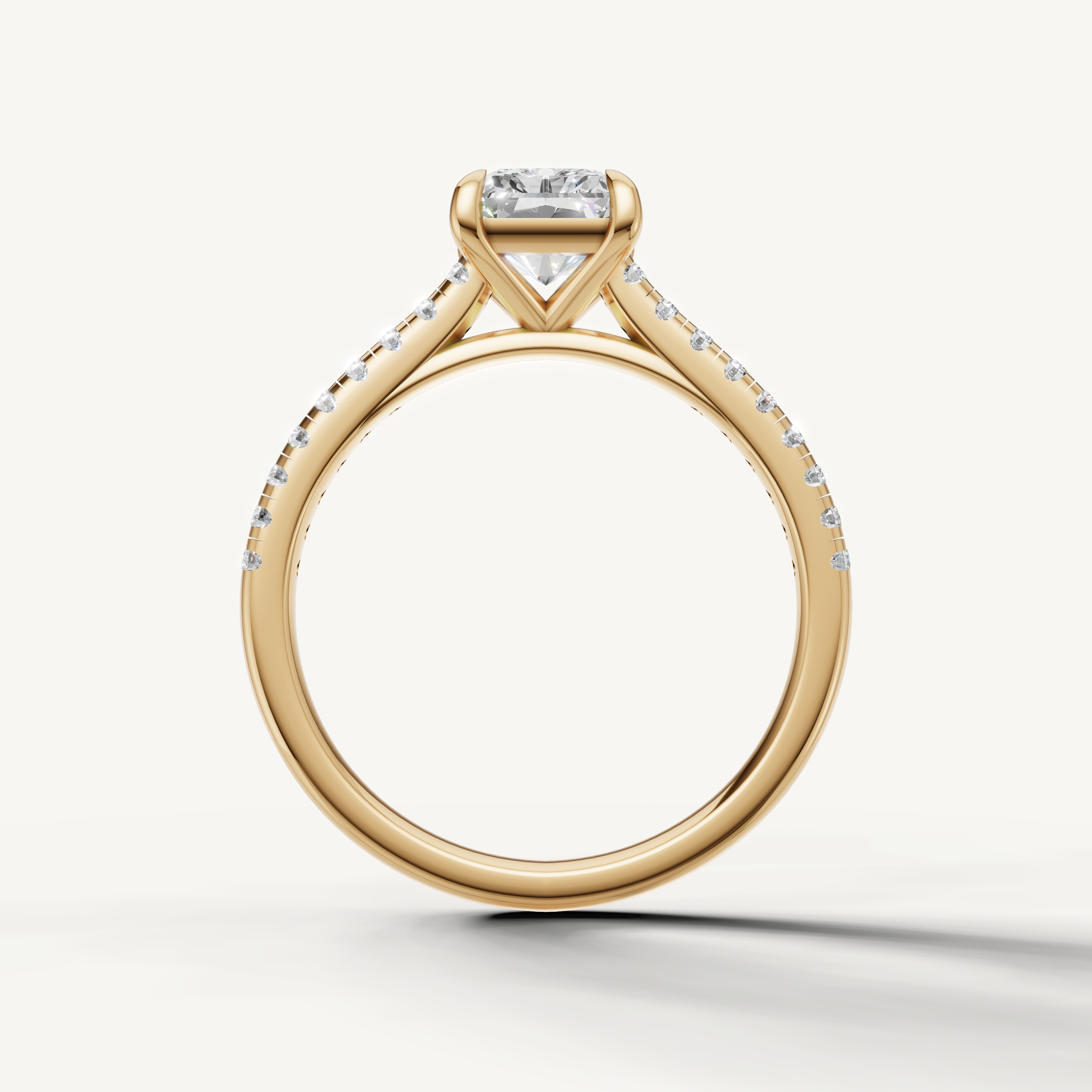 Raul Diamonds handcrafted radiant engagement ring in yellow gold with modern diamond detailing