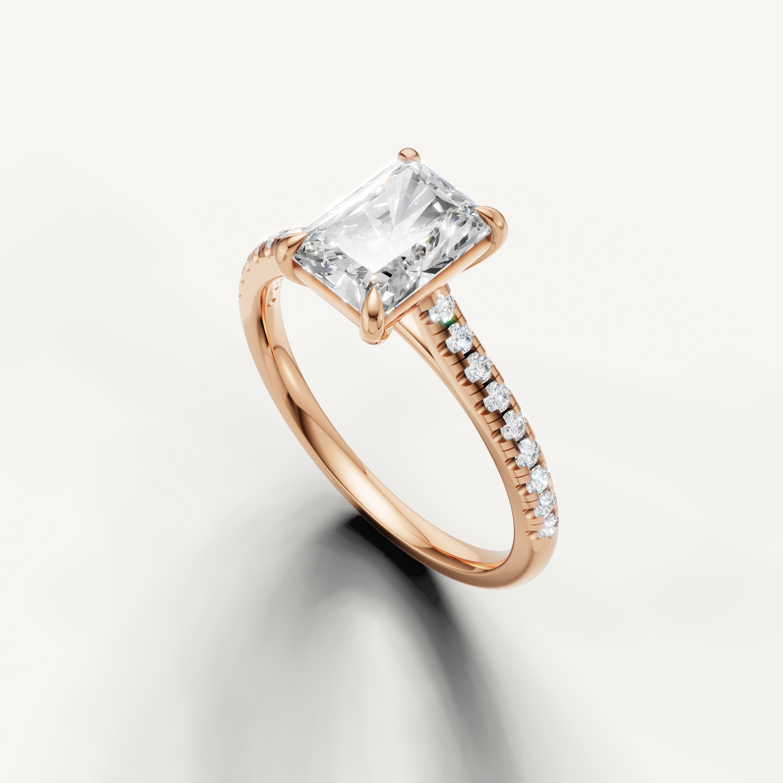 Luxury radiant cut rose gold engagement ring with diamond accented band by Raul Diamonds