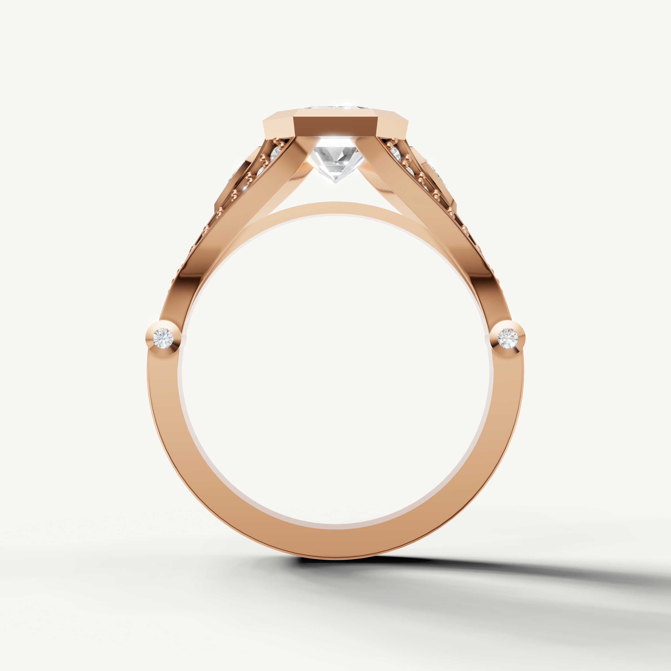 Brilliant Seo rose gold bezel emerald cut diamond ring with intricate detailing by Raul Diamonds.