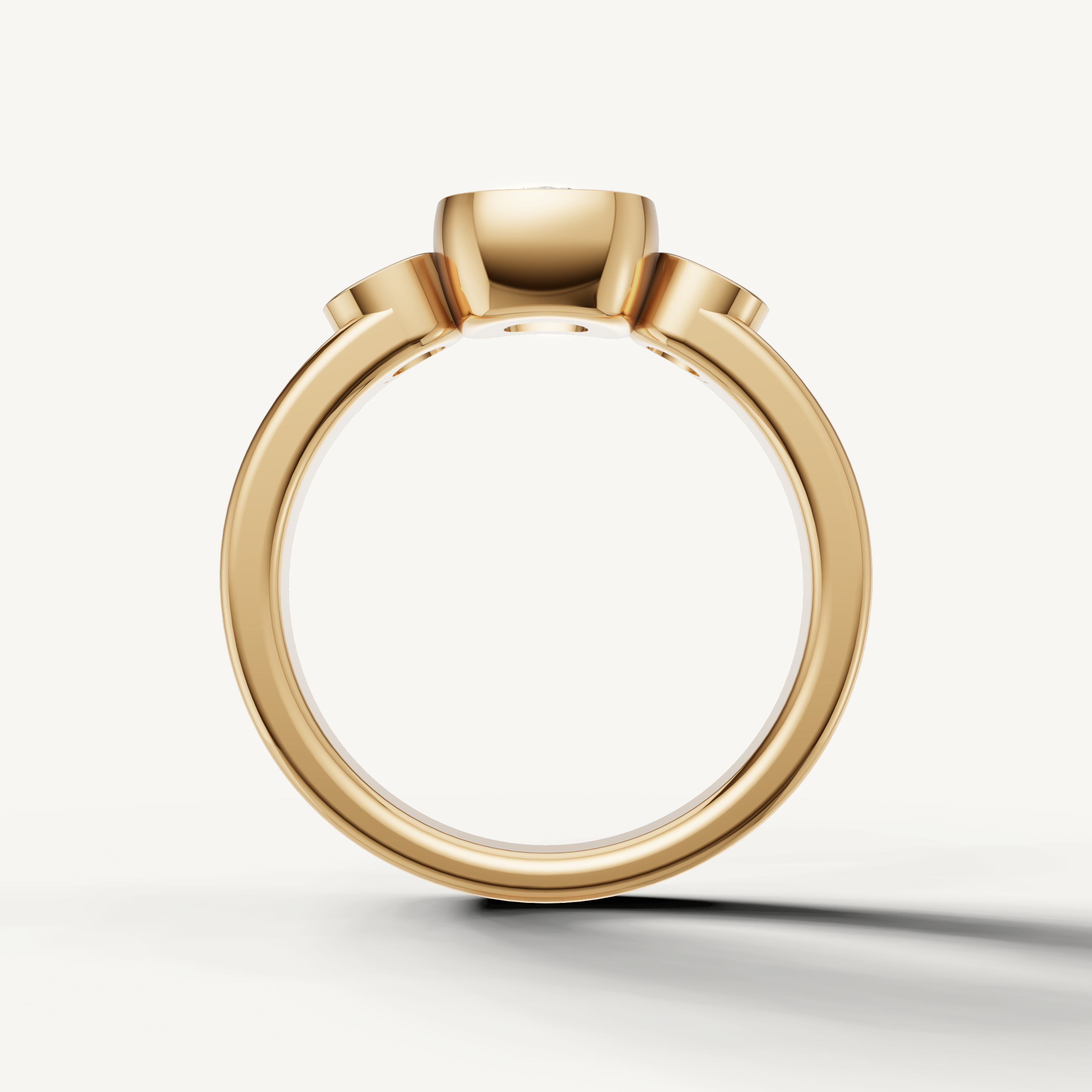 Close-up of Seo yellow gold cushion bezel ring with brilliant diamonds by Raul Diamonds.